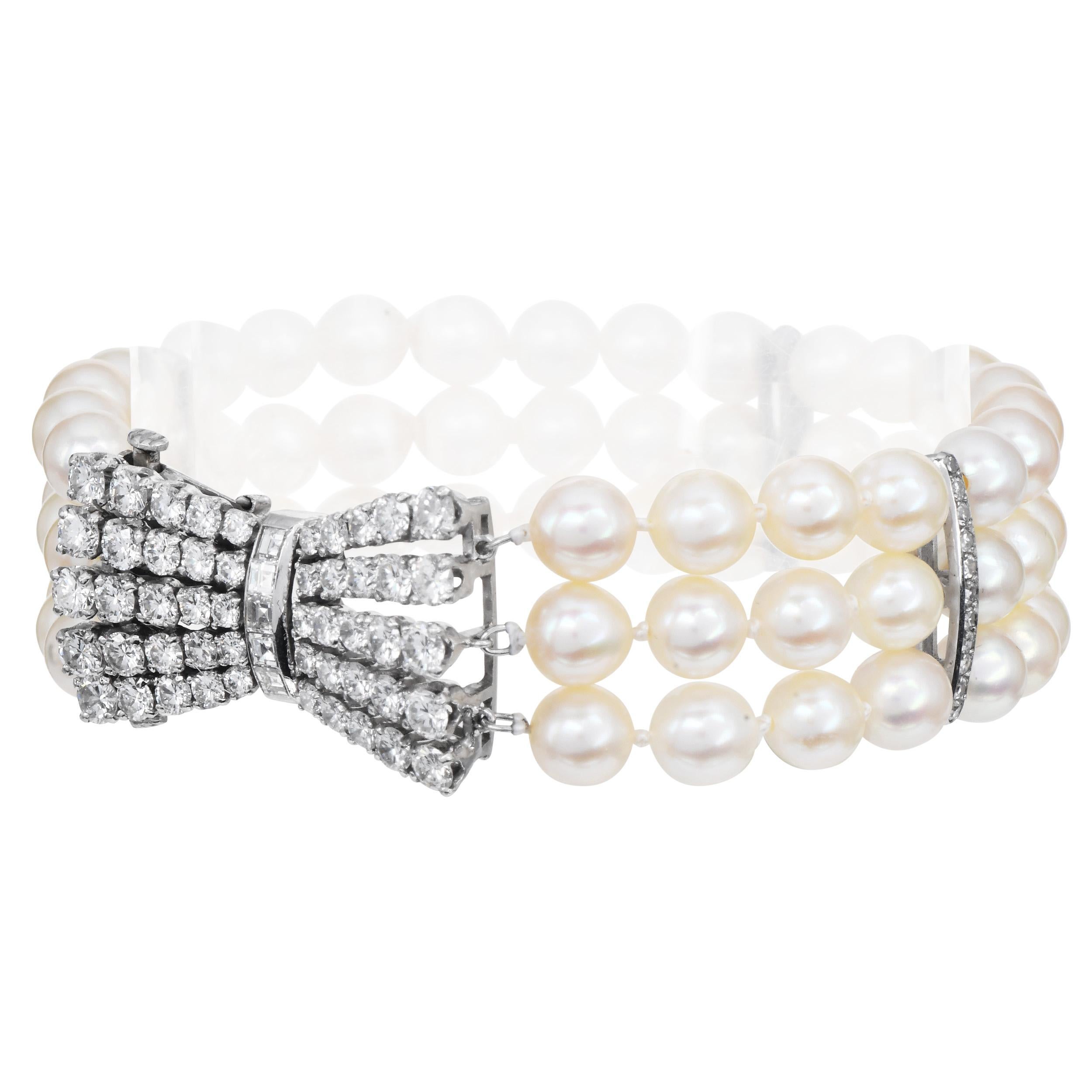 Round Cut Platinum Diamond Akoya Pearl Bow Clasp Three Strand Bracelet For Sale