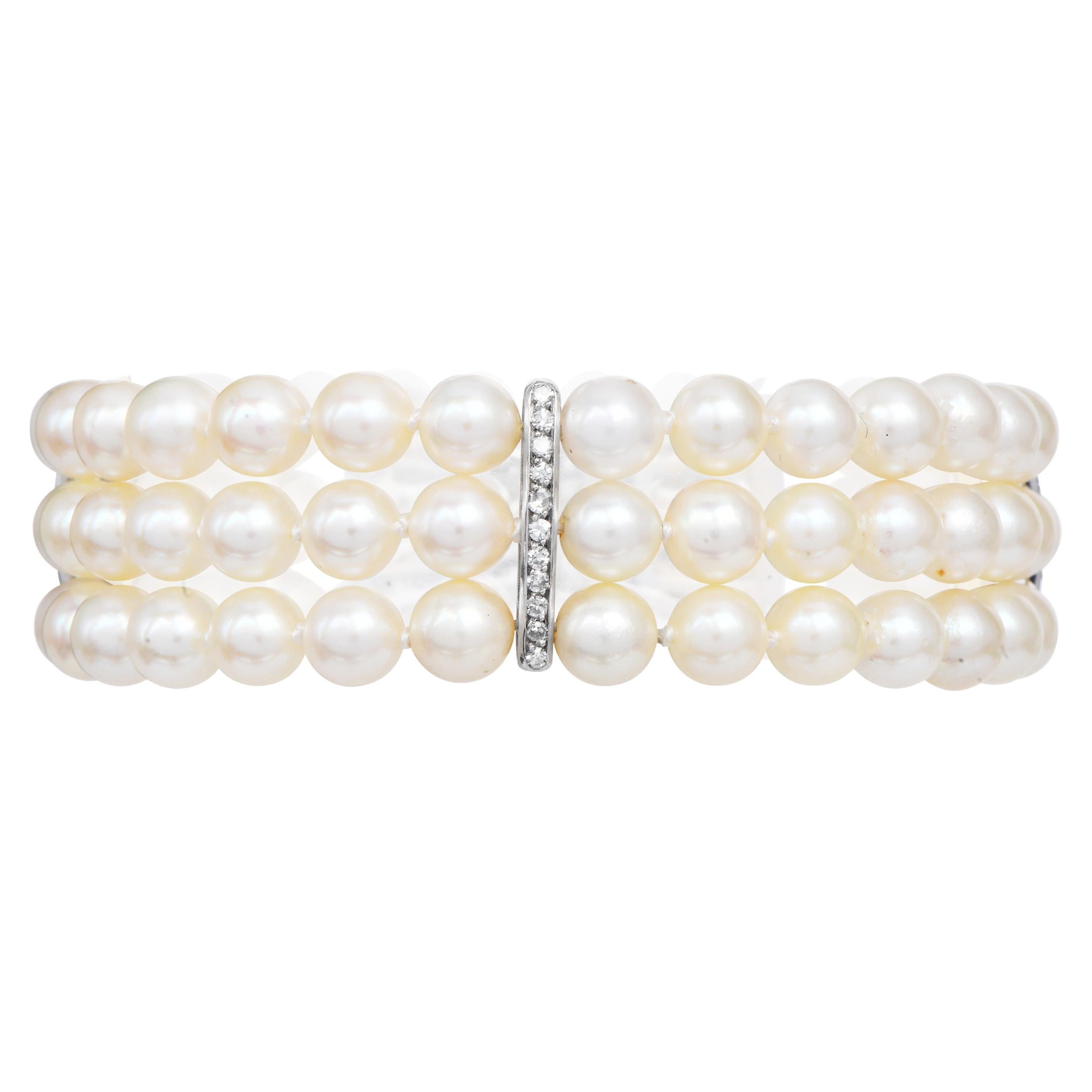 Women's Platinum Diamond Akoya Pearl Bow Clasp Three Strand Bracelet For Sale