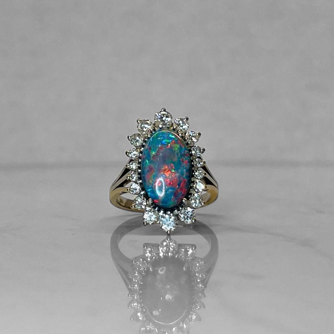 
Introducing a masterpiece of opulence and sophistication: the Platinum Diamond and Black Opal Ring. This exquisite piece is a true work of art, set in luxurious platinum, known for its durability and timeless allure. At the heart of this ring is an