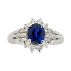 Platinum Diamond and Blue Sapphire Halo Ring Platinum Diamond and Blue Sapphire Halo Ring
