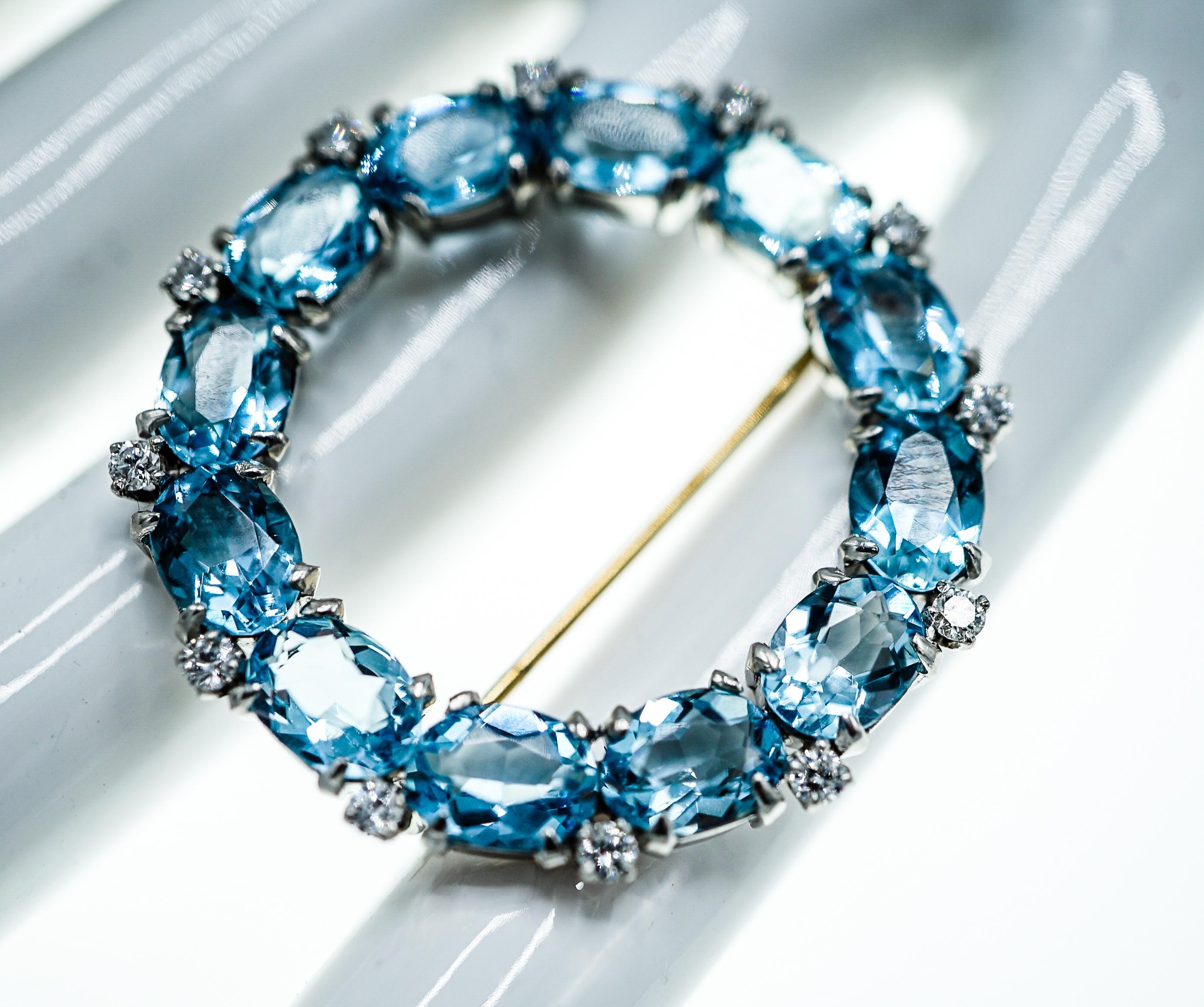 Platinum, Diamond and Blue Topaz Circle Brooch 
This piece features 12 oval blue topaz stones and  12 round diamonds ap. .40 ct.
Gold pin stem 
Diamonds: G-H-I/VS-SI 
Blue Topaz: lively, medium blue color, lightly included, well-cut, well matched