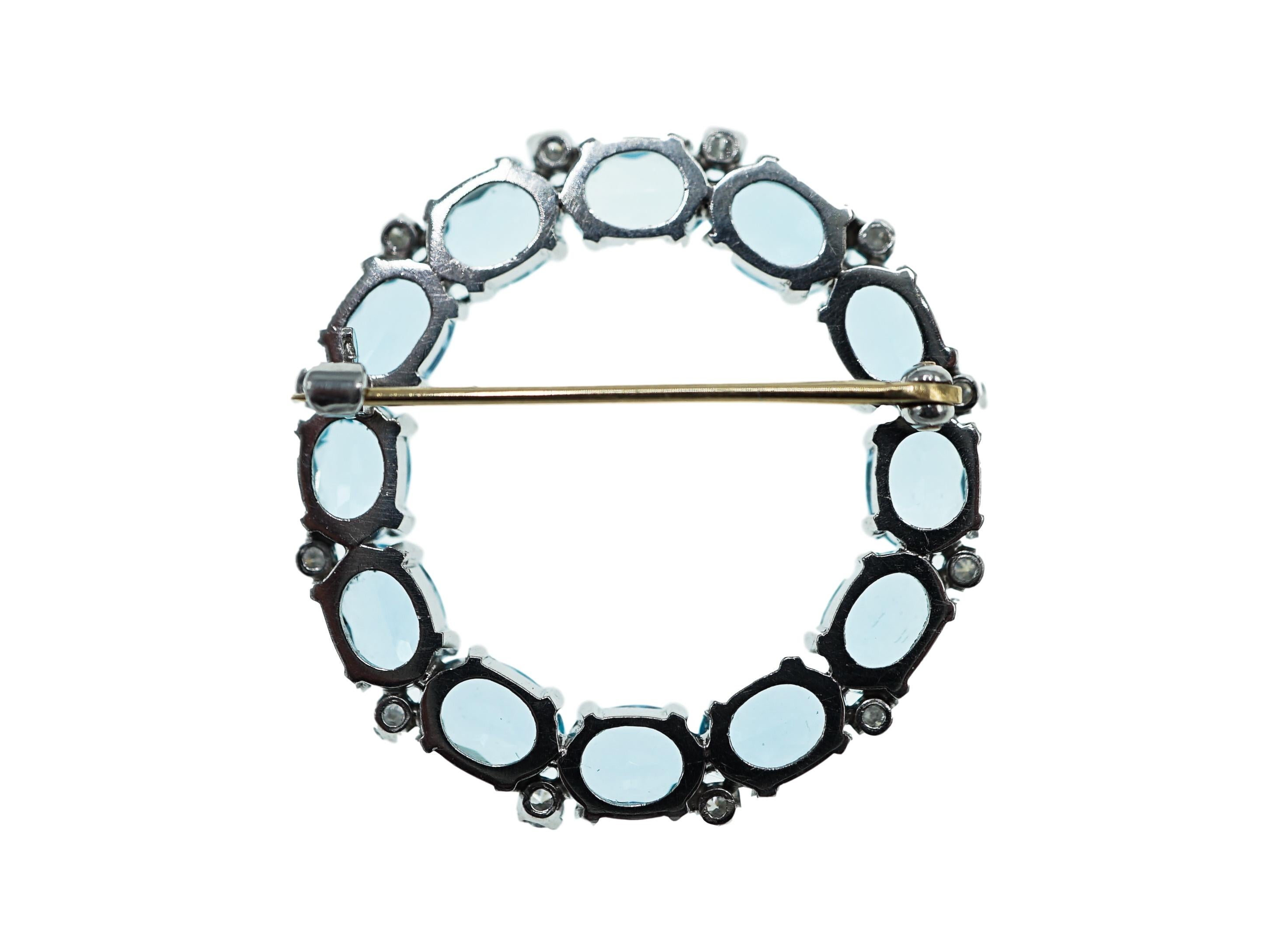 Platinum, Diamond and Blue Topaz Circle Brooch In Excellent Condition In New York, NY