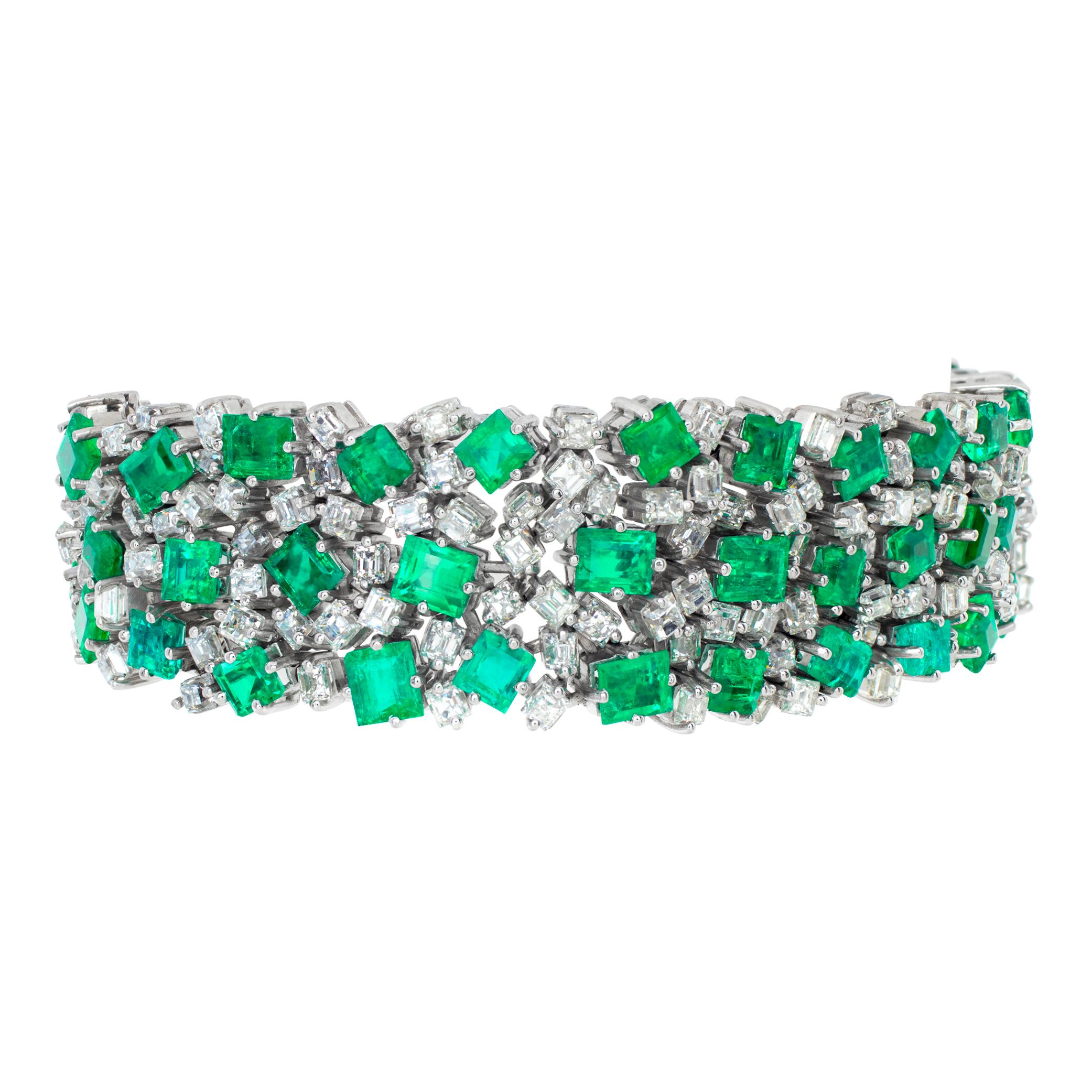 Vintage diamond and emerald platinum bracelet with over 17 carats in diamonds (H, VS) and 32 carats in Columbian emeralds. Length: 7 inches. Width tapers from 0.75 to 0.50 inches
