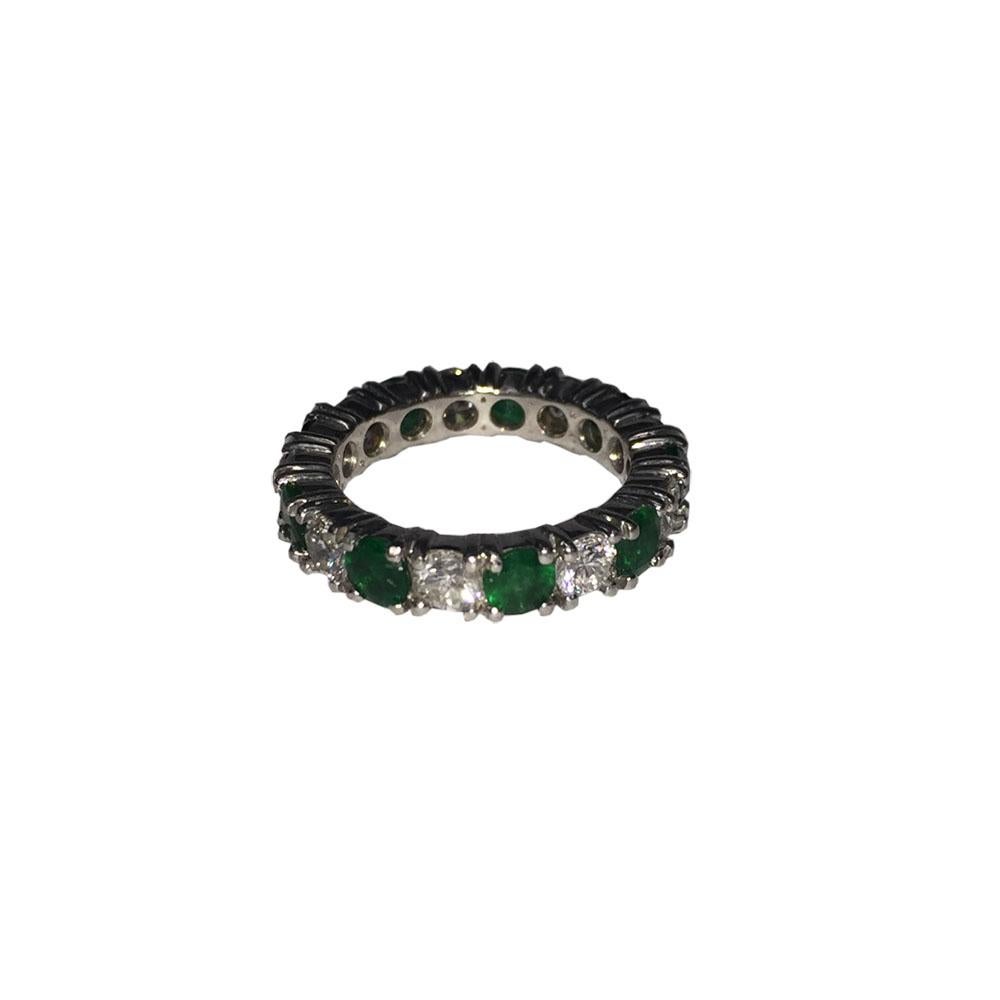 Platinum Diamond and Emerald Eternity Band In New Condition For Sale In New York, NY
