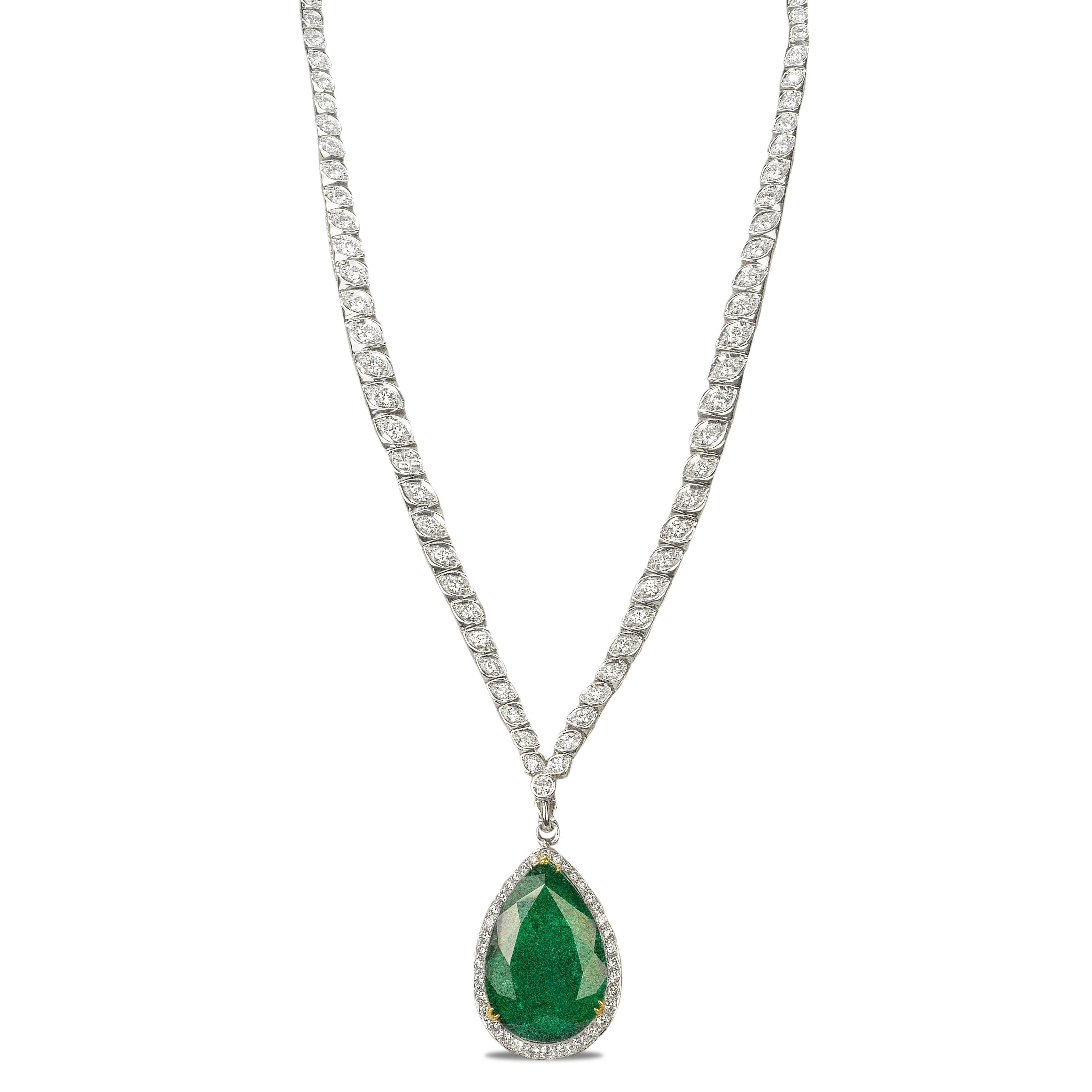 Platinum Necklace with 126 round brilliants and 3 baguette diamonds weighing approximately 5.50 carats. Suspended from the bottom is one detachable pendant containing one pear shape emerald weighing 10.11 carats and round brilliant diamonds weighing