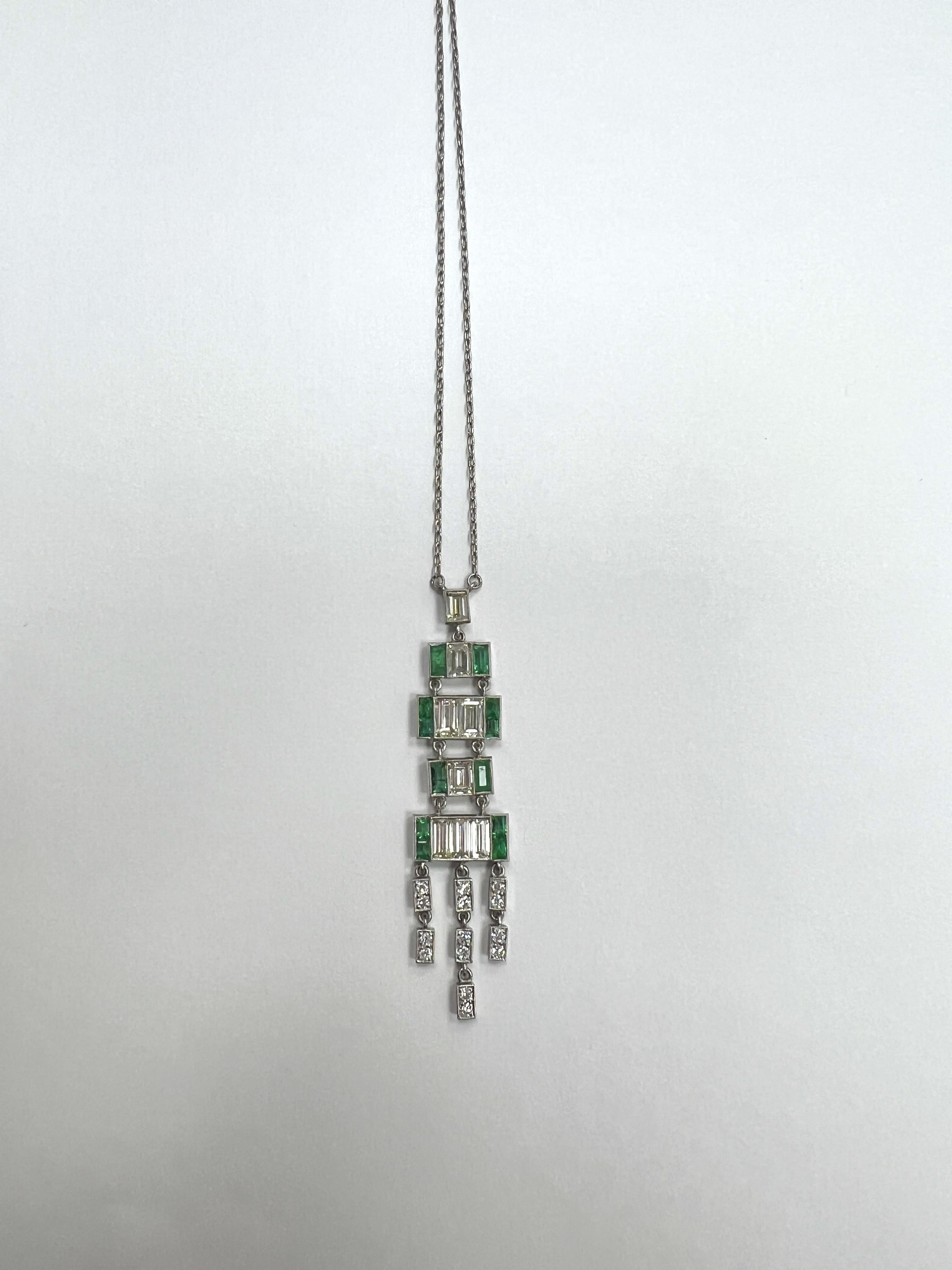 Platinum, Diamond and Emerald Pendant Necklace.

Art Deco style. Platinum pendant with 8 baguette-cut diamonds that weigh approx. 2.00 cts, columbian emeralds that weigh approx. 1.02 ctw, and diamonds that weigh approx. 0.29 ctw, and a platinum