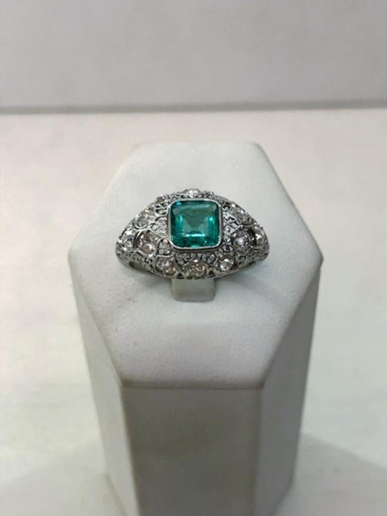 Platinum ring with milligrain dome, a central emerald of 1.30 carats and surrounding diamonds for a total of 1.30 carats / Made in Italy 1930s-1940s
Ring size US 7.25