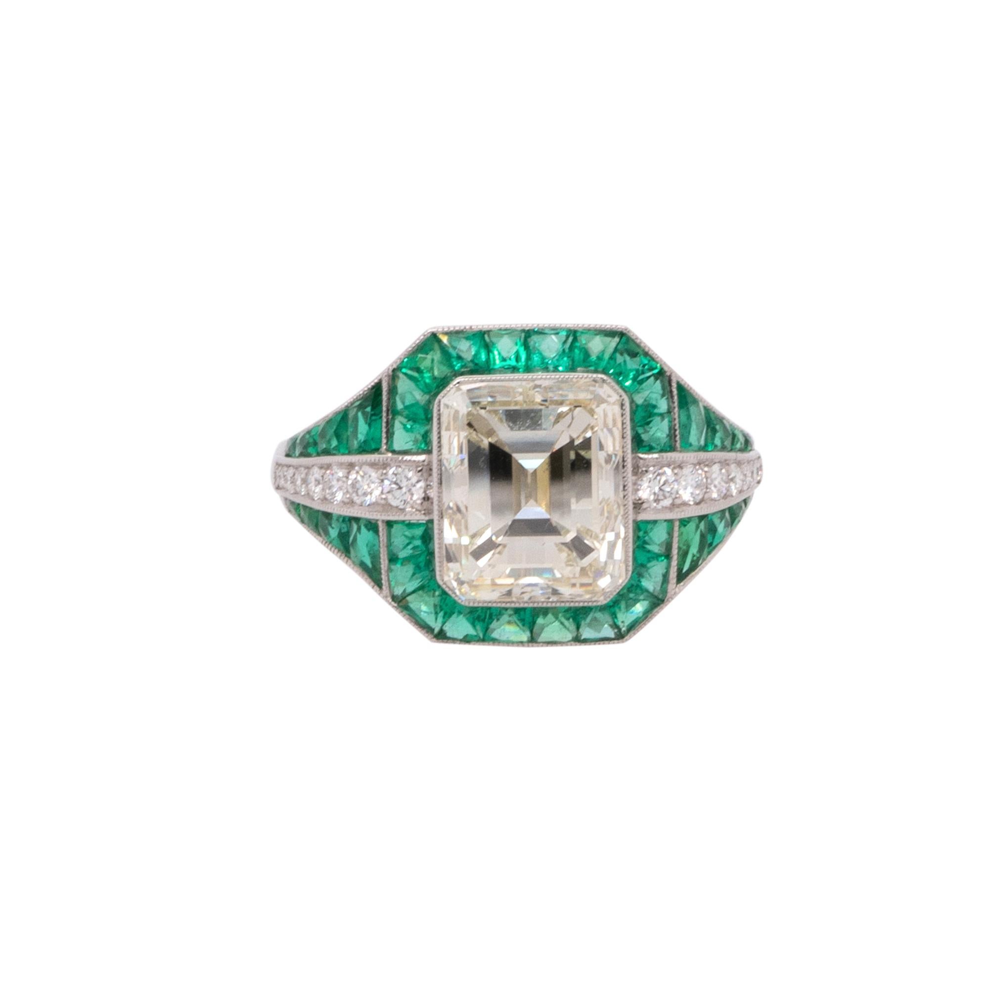 This exquisite Platinum Ring showcases a captivating 4.00-carat Emerald-Cut Diamond graded L-M in color and VS2 in clarity, making it a dazzling centerpiece with warm, vintage appeal. Accented by 0.23 carats total weight of round brilliant diamonds