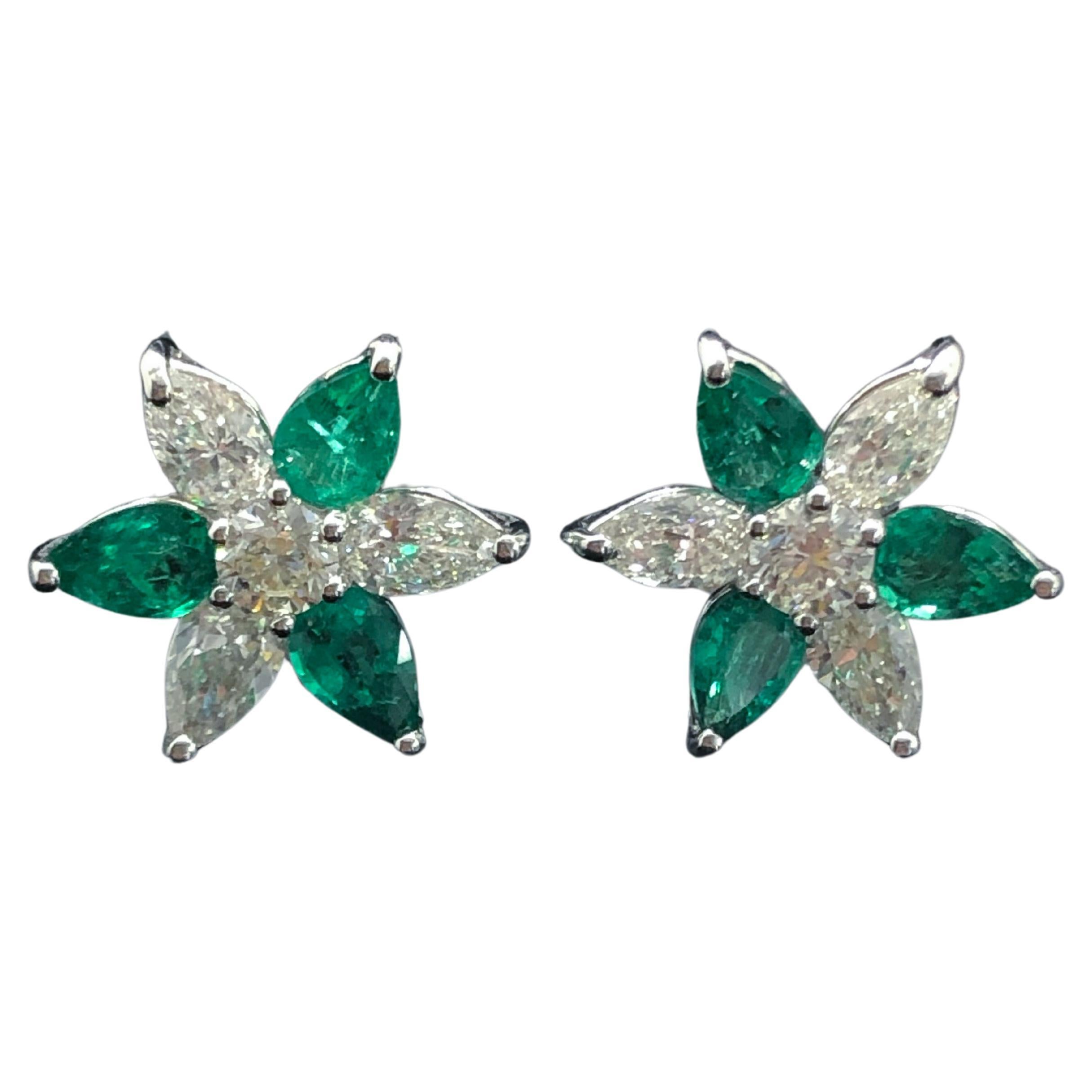 The platinum pear shape diamond and pear shape emerald star earrings are a classic design that exudes elegance. With a combination of a 2.27 CTS of emerald, 1.83 CTS pear shape diamond, and 0.60 carat of round diamonds, these earrings are truly a