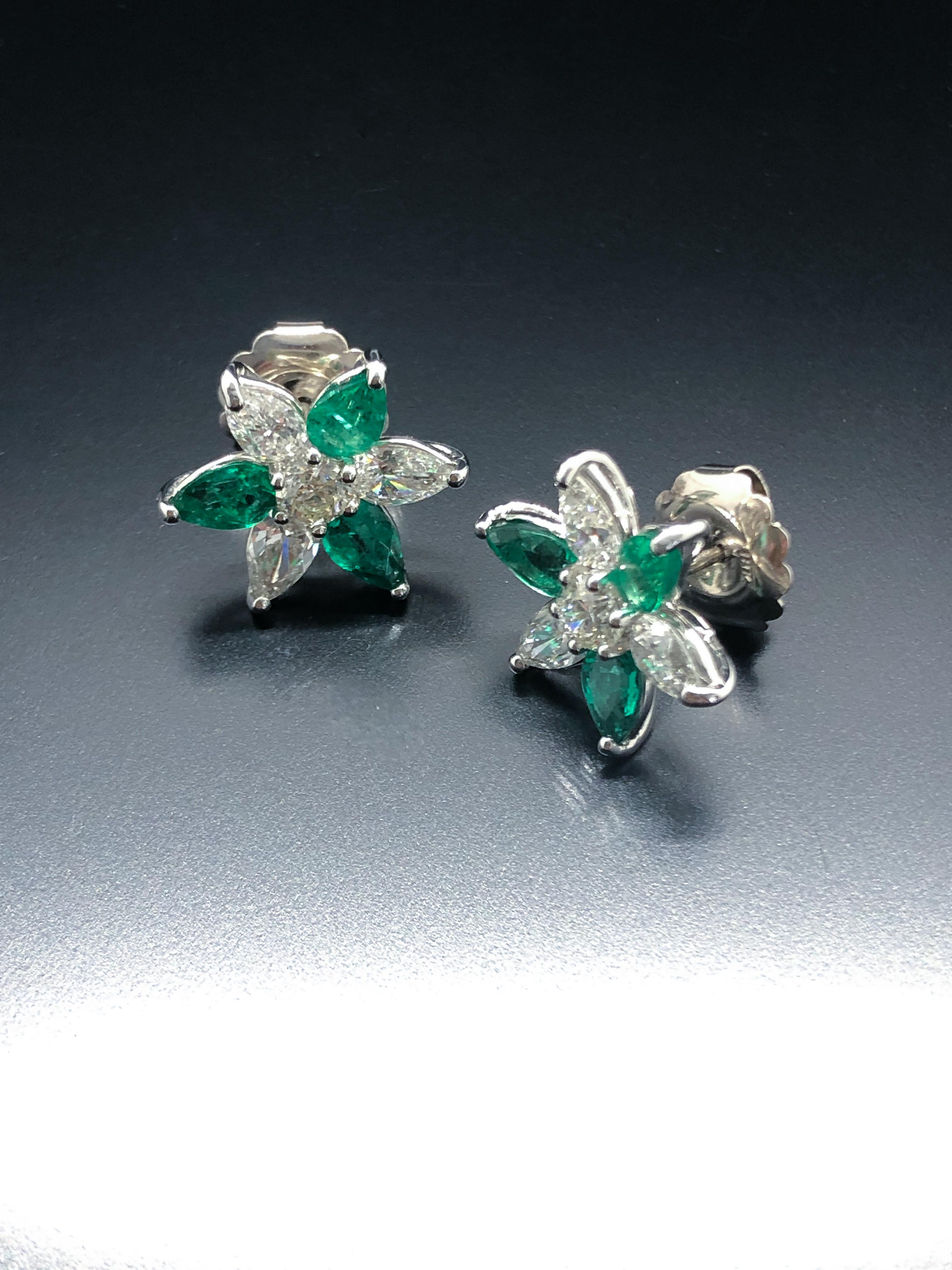 Modern Platinum Diamond and Emerald Star Earrings For Sale