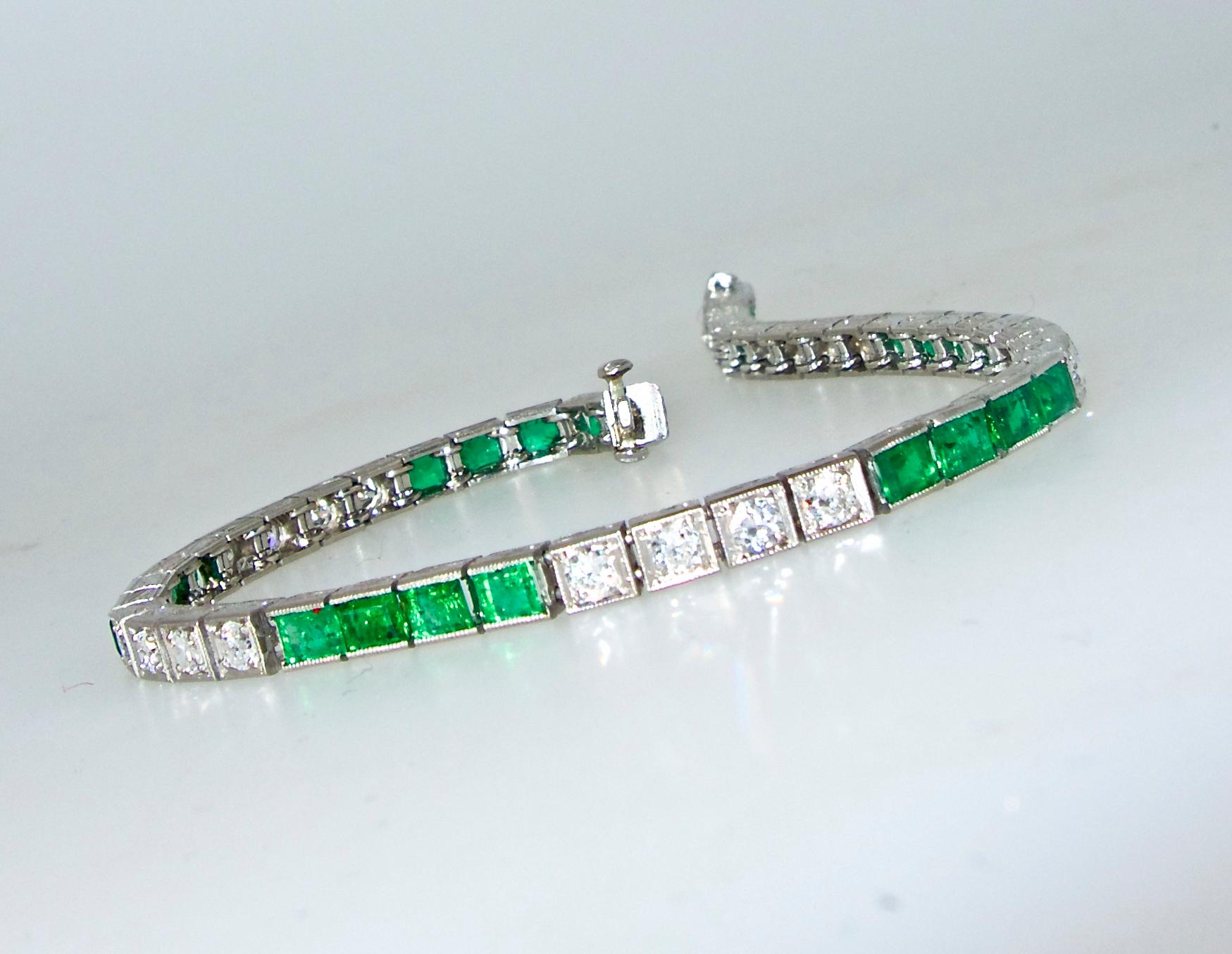 Platinum, with highly engraved edges,  straight-line emerald and diamond bracelet, very flexible, with square cut emeralds and round brilliant cut diamonds, the 24 bright green Colombian emeralds weigh approximately 6.7 cts., and the 24 round