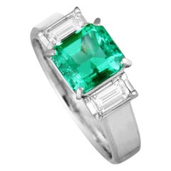Platinum Diamond and Emerald Three-Stone Ring Platinum Diamond and Emerald Three-Stone Ring