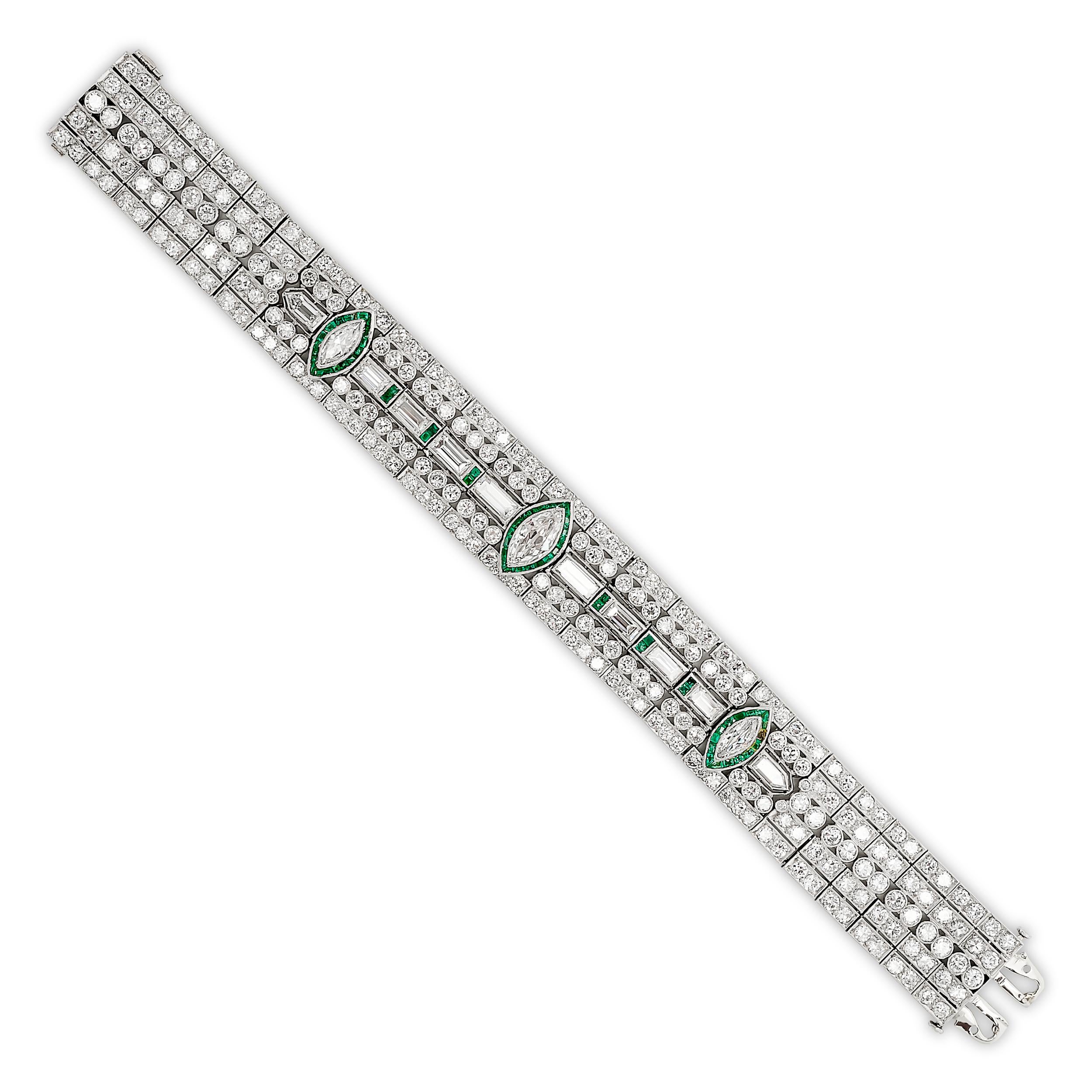 A striking bracelet featuring a central marquise-cut emerald flanked by baguette and round diamonds, all set in a geometric platinum mounting.

This bracelet has approximately 19.00 total carat of diamonds. Including:
1 Marquise Diamond ~1.00ct,
