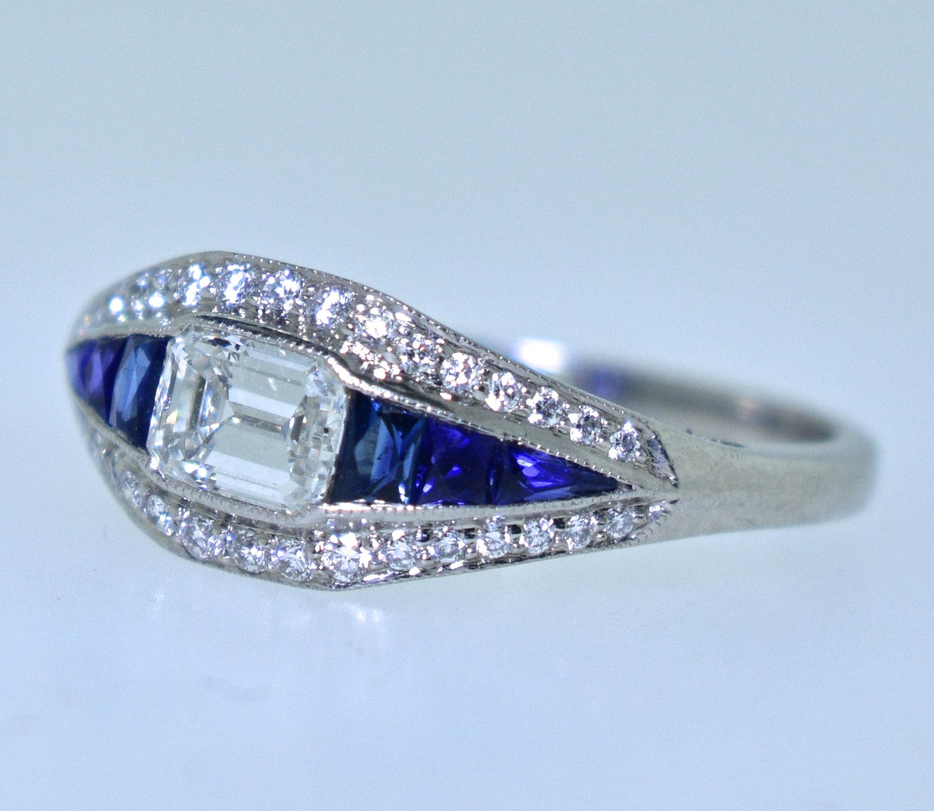 Diamond and natural bright blue sapphire platinum ring.  1.2 cts of fine white diamonds (G/H, VS1), and .39 cts of natural fancy blue sapphires.  This ring is new and in excellent condition.   It was hand made, and a size 6.5 and can be altered.