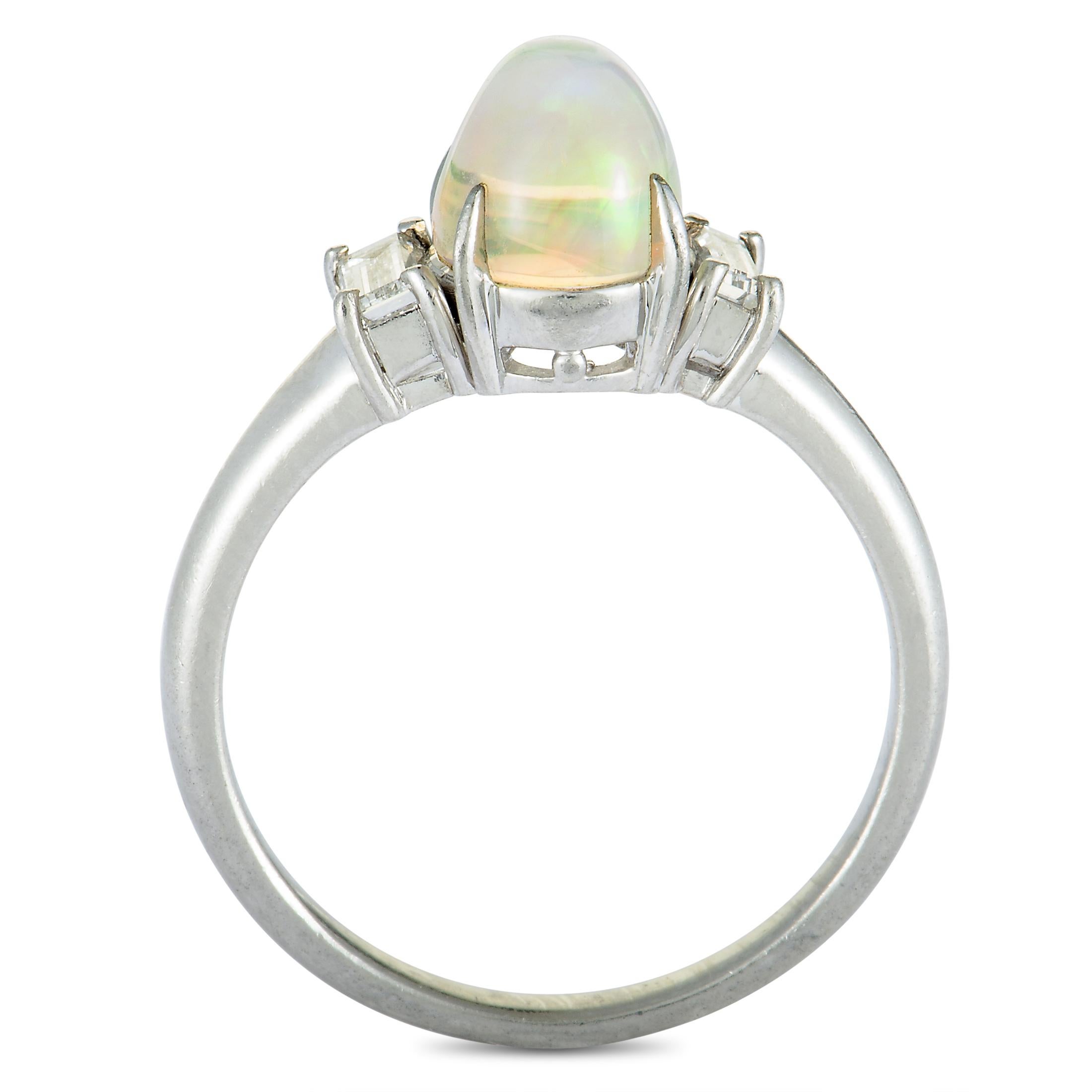 A harmonious fusion of elegant platinum and sublime gems, this fascinating ring offers an exceptionally refined appearance. The ring is set with a gorgeous opal that weighs 1.82 carats and with superb diamonds that amount to 0.29 carats.
Ring Top