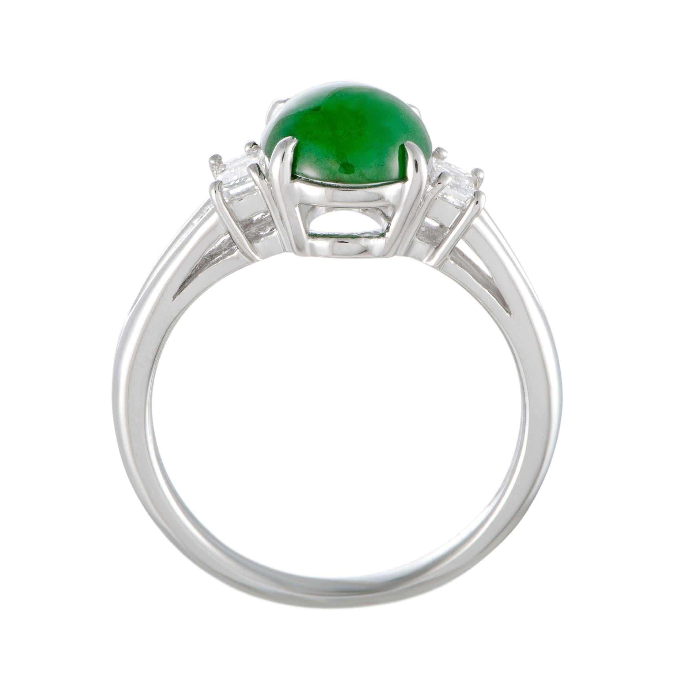 This gorgeous platinum ring offers a delightfully feminine appearance thanks to the exceptionally elegant design that is topped off with stunning gems. The center stone of the ring is an eye-catching green jade that weighs 1.97 carats and is