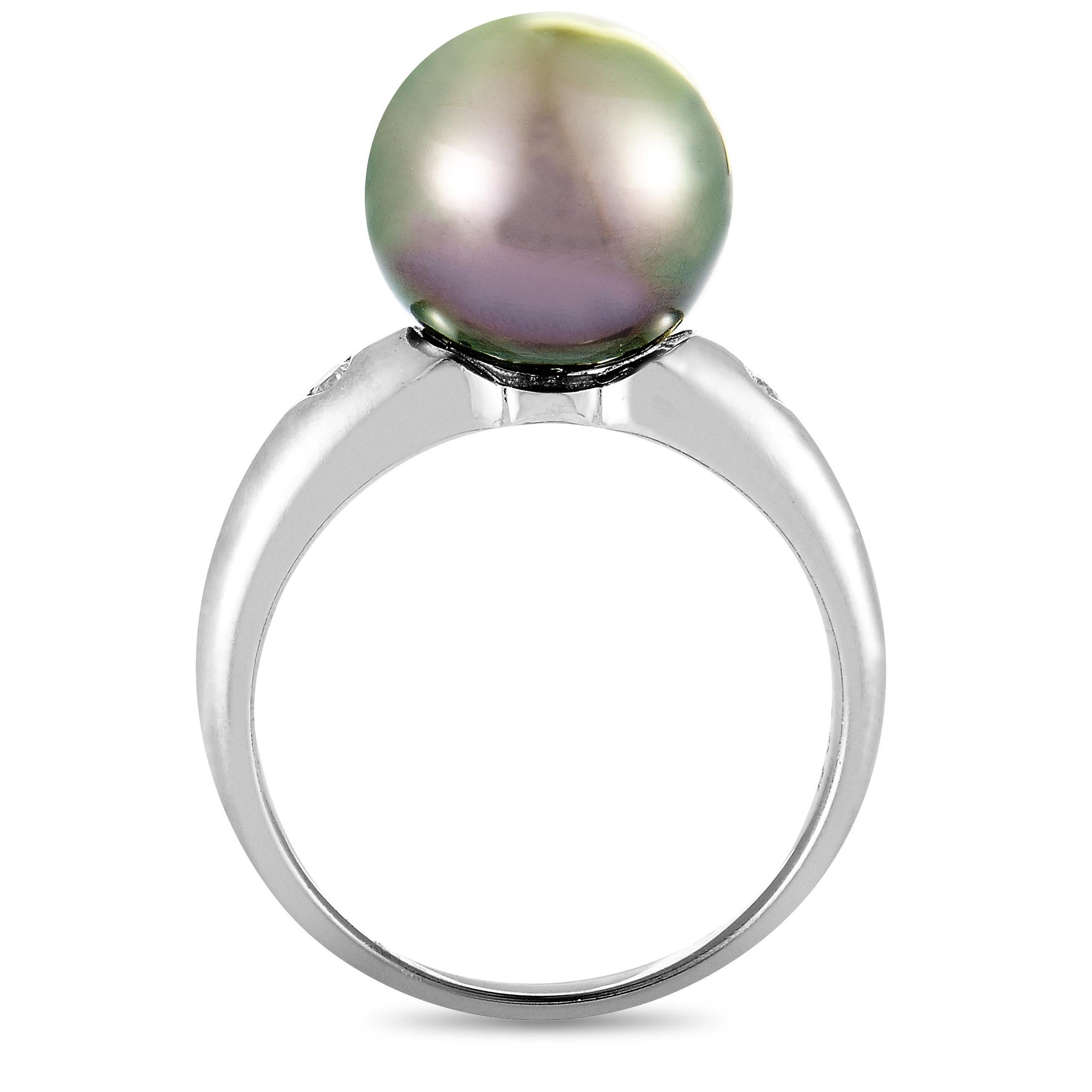 This ring is crafted from platinum and set with a 12.1 mm black pearl and with diamonds that total 0.06 carats. The ring weighs 9.1 grams, boasting band thickness of 2 mm and top height of 12 mm, while top dimensions measure 15 by 12 mm.

Offered