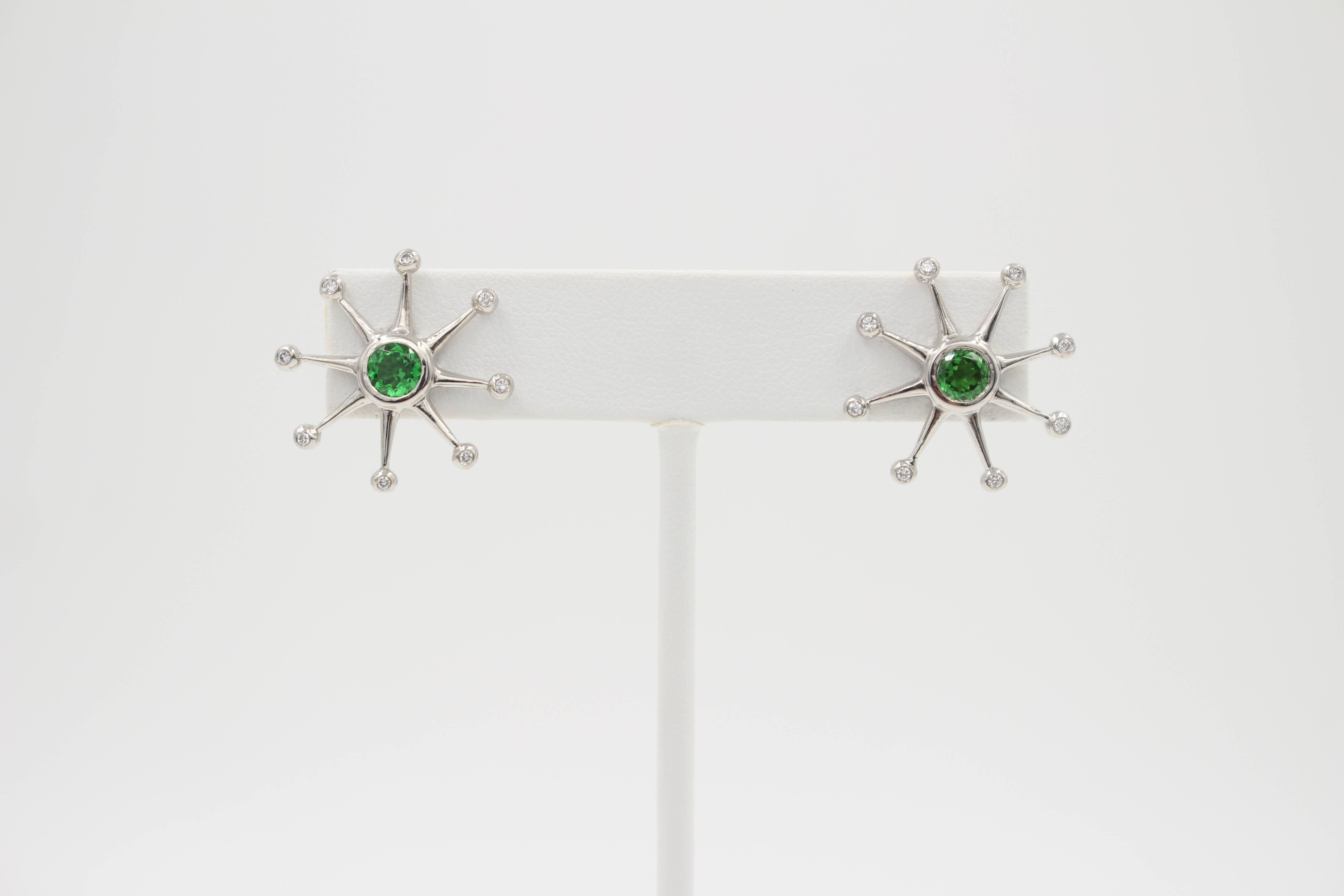 The Eight Ray Star Earring are Platinum with round brilliant cut Peridot center stones and round brilliant cut diamonds on the very tip of each star ray.  The elegant and refined earrings are a delightful accent to any ensemble whether it formal or