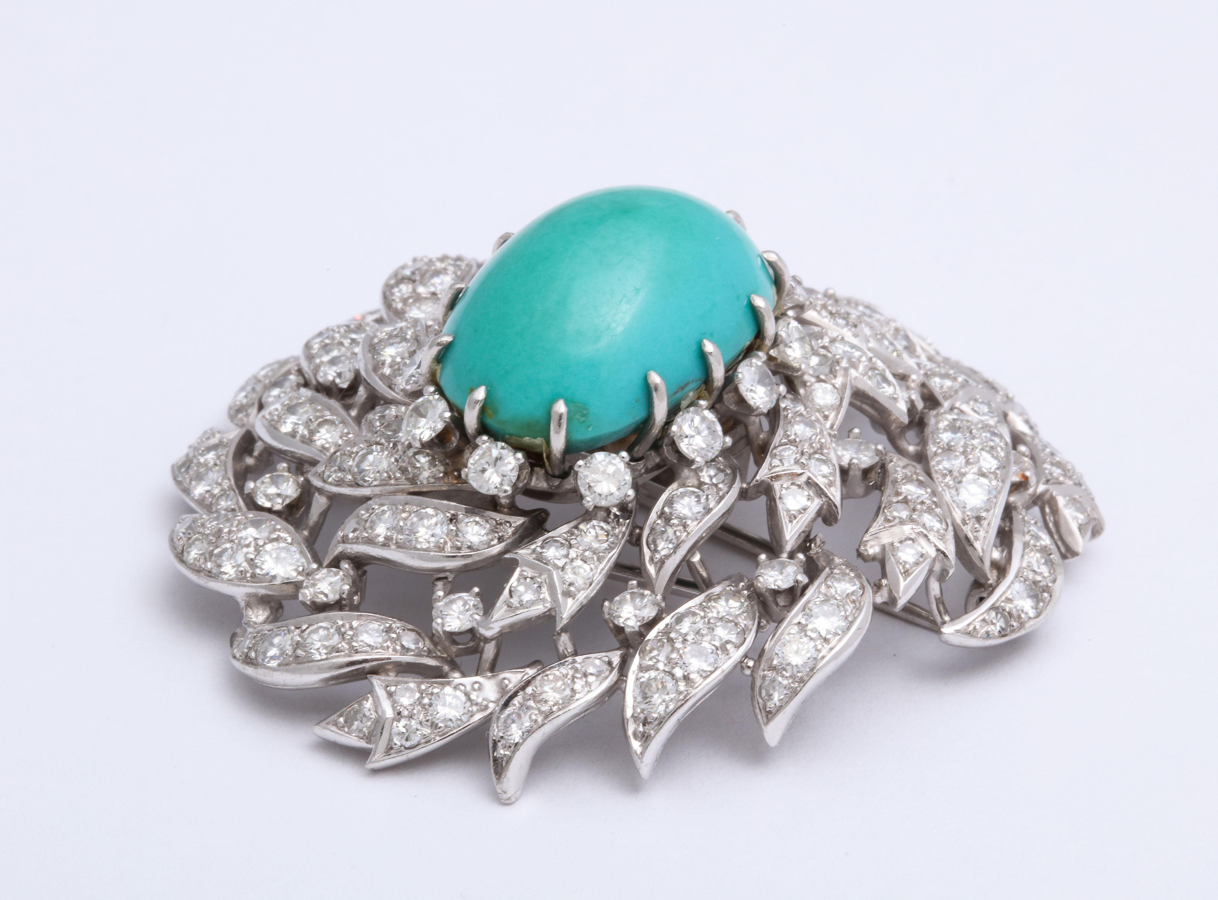 Ravishing  assymetric Persian Turquoise & Diamond Brooch resembling a Peacock's Eye.  Prong set  & pave stones set in Platinum.
Height of opulence and excess!  Ca 1940/50  Scads of Diamonds.  Two Prong clip attachment Over 6 carats

