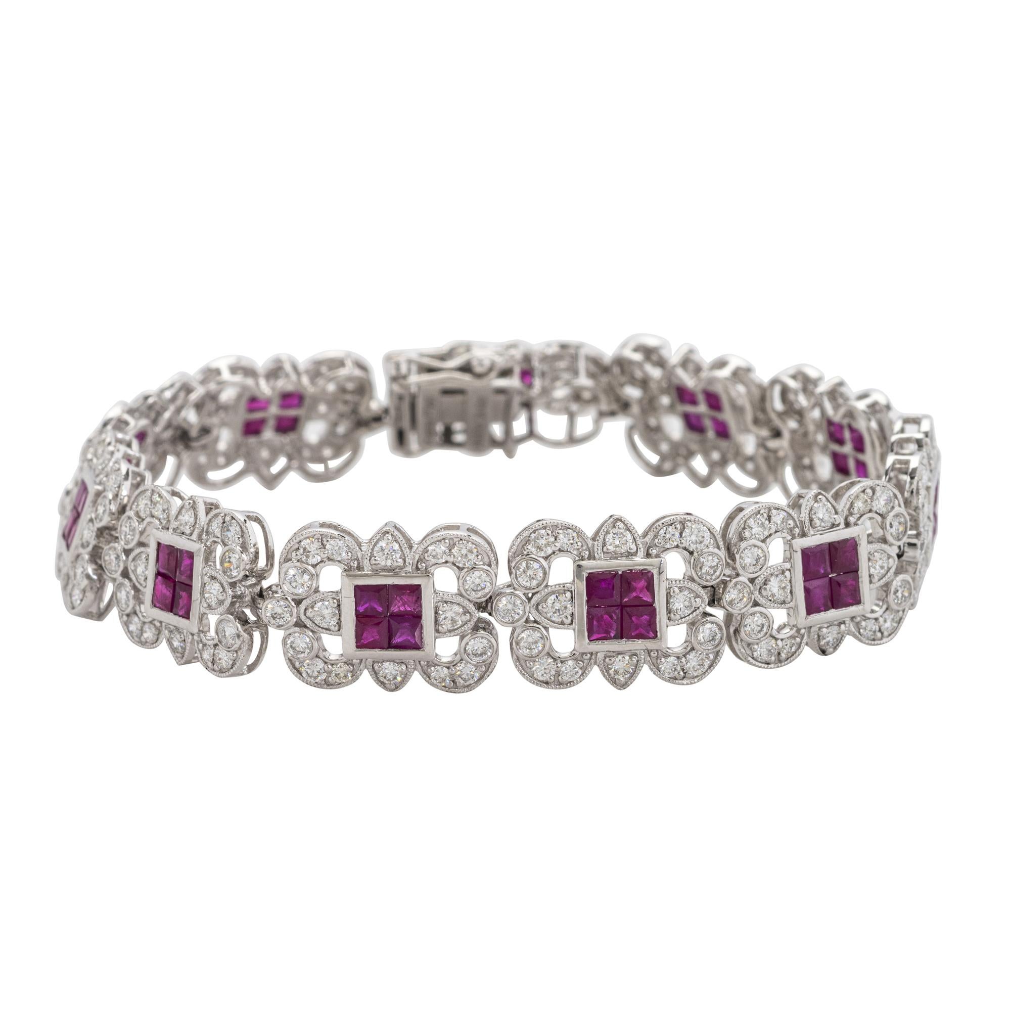 PLATINUM, DIAMOND AND RUBY BRACELET
Of openwork geometric design, each plaque set with four square cut rubies and framed by diamonds,
Forty-four bezel set square cut rubies with a total weight of 5.57 carats, diamonds weighing a total of 4.42