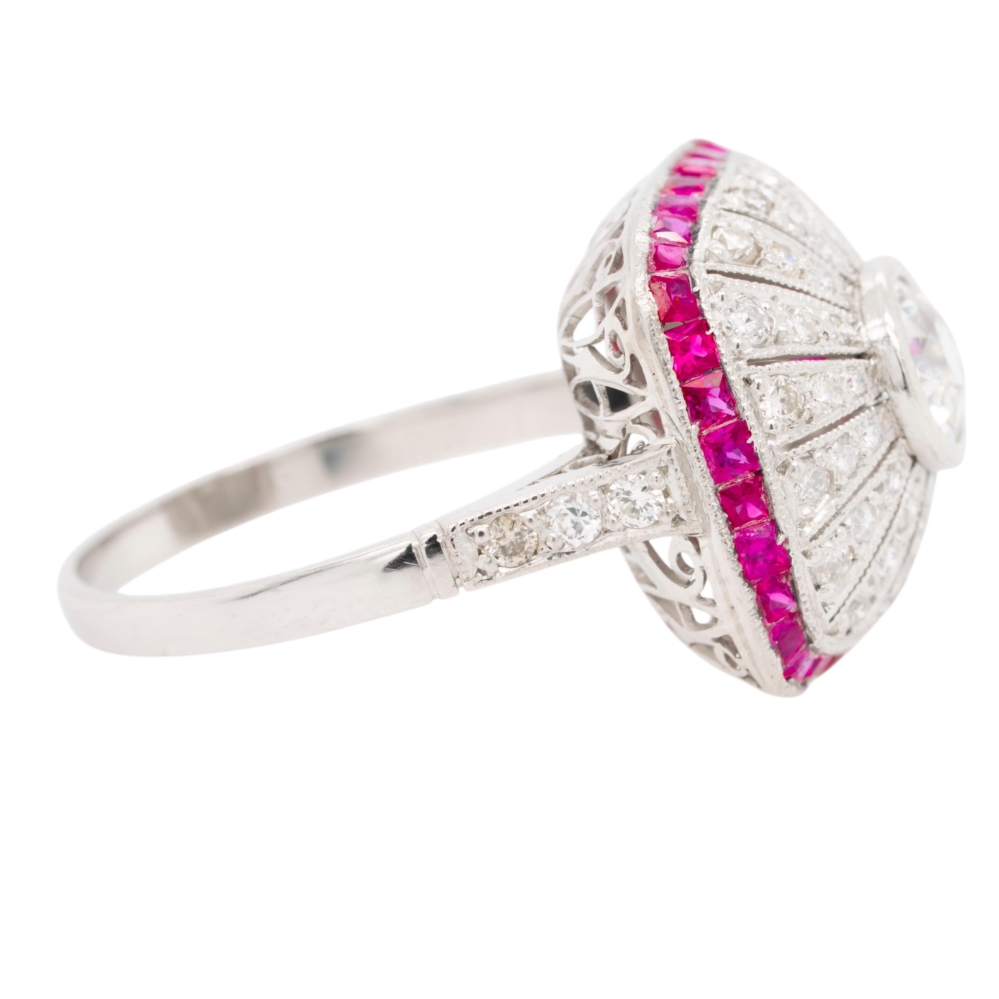 This Platinum Ring features a captivating centerpiece with an approximate 1.0-carat natural diamond, beautifully complemented by approximately 0.50 carats of additional diamonds and 0.50 carats of rich red rubies. This exquisite combination of