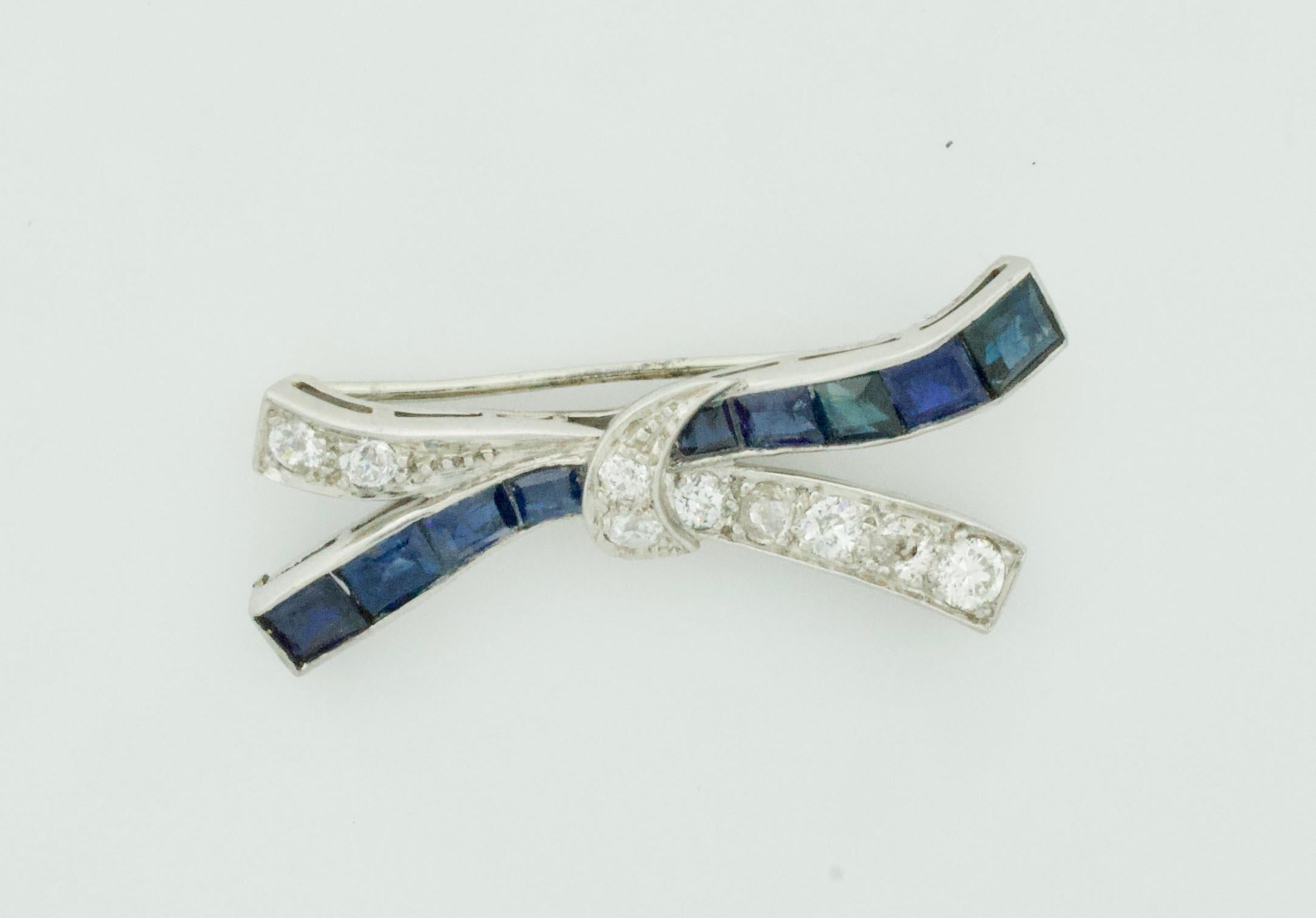 Platinum Diamond and Sapphire Bow Brooch Circa 1920's
Nine Baguette Cut Sapphires Weighing 2.50 Carats Approximately 
Nine Old European Cut Diamonds Weighing 1.00 Carats Approximately [GH - VS-SI]