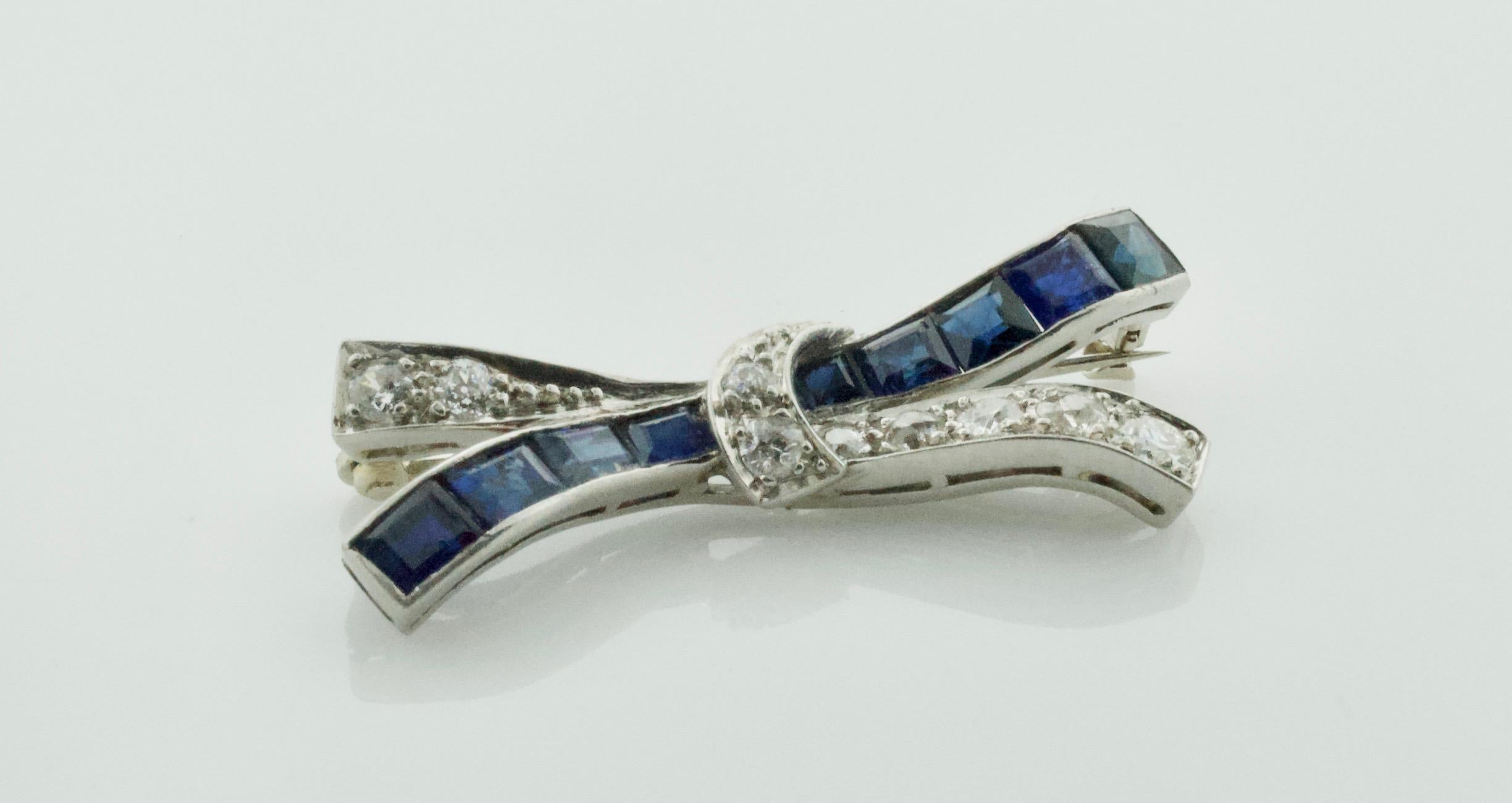 Art Deco Platinum Diamond and Sapphire Bow Brooch, circa 1920s For Sale