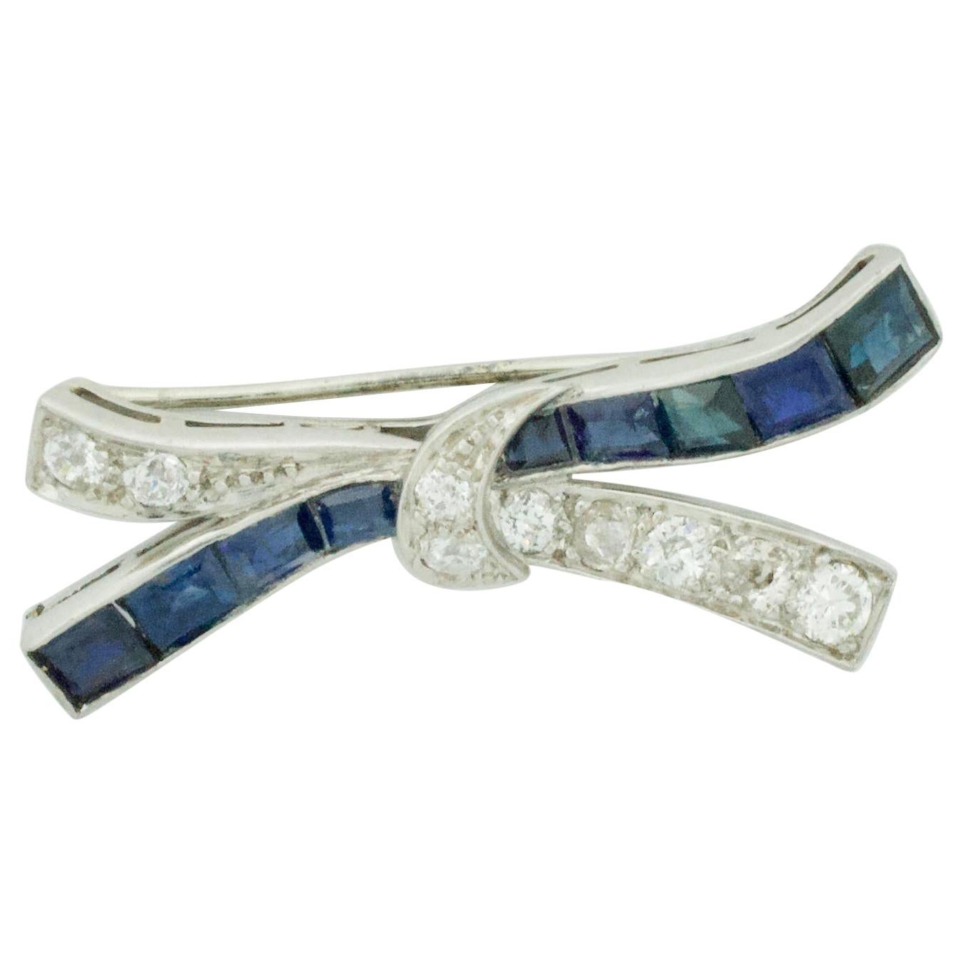 Platinum Diamond and Sapphire Bow Brooch, circa 1920s For Sale