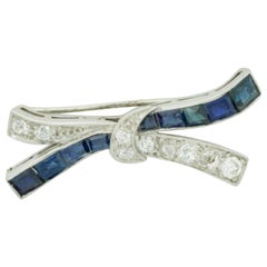 Antique Platinum Diamond and Sapphire Bow Brooch, circa 1920s