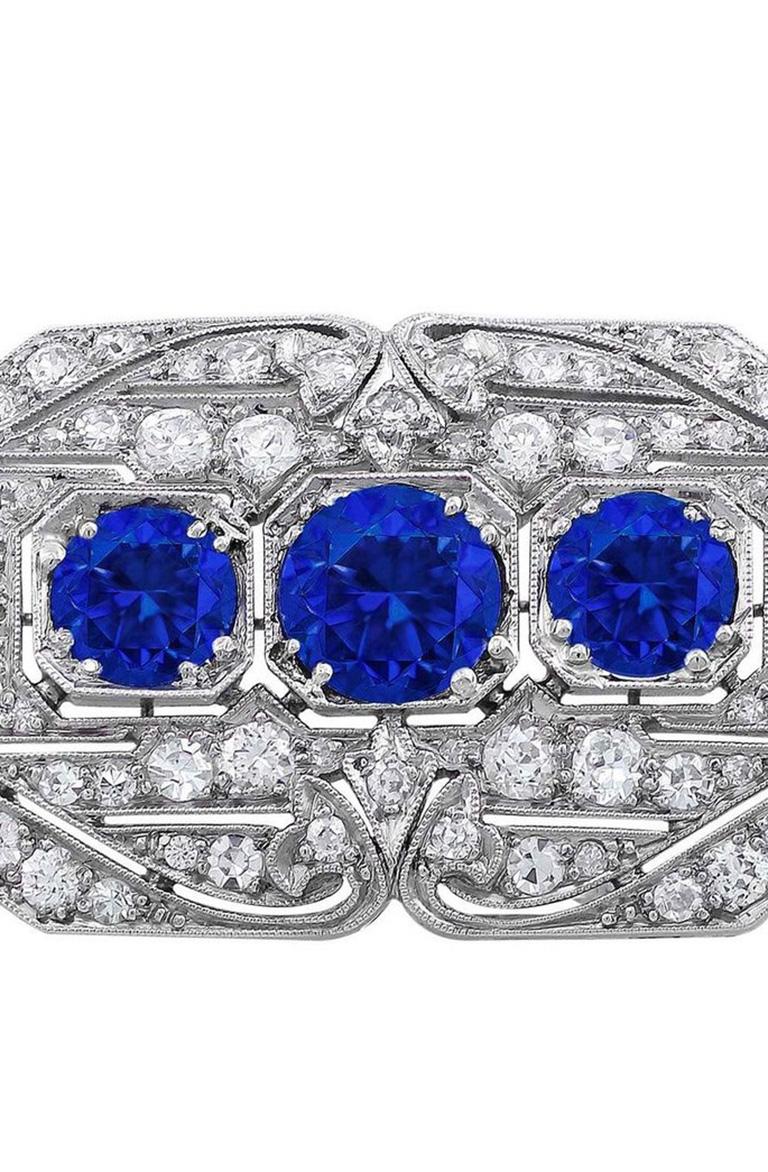 Round Cut Platinum Diamond and Sapphire Brooch For Sale
