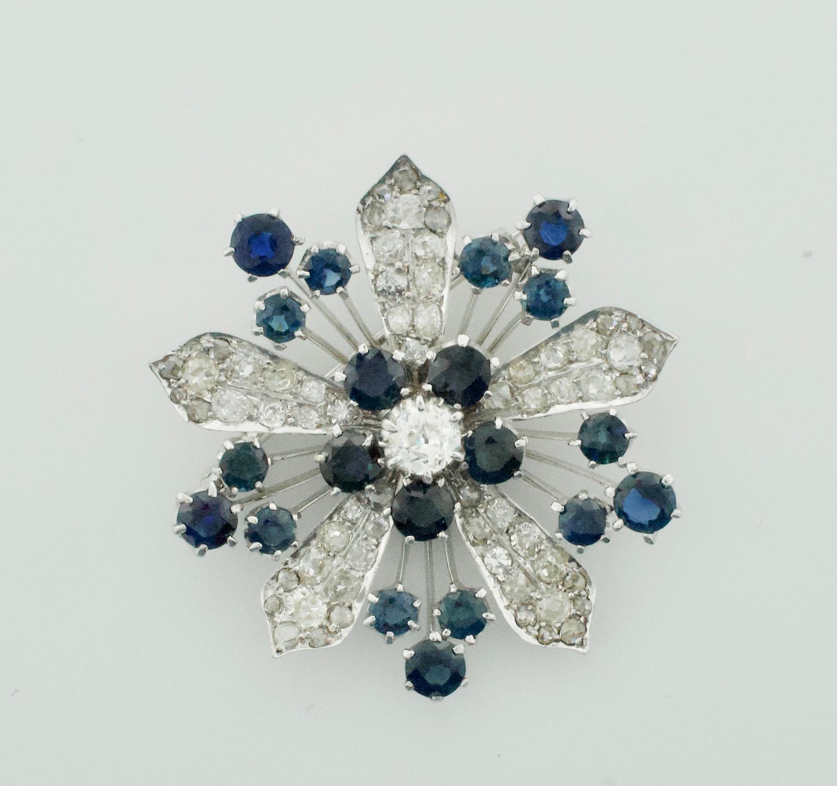 Platinum Diamond and Sapphire Brooch - Necklace Circa 1920's 6.85 carats.
One Old European Cut Diamond weighing .65 carats approximately [GHI - SI]  [bright with no imperfections visible to the naked eye]
Thirty Five Round Cut Diamonds weighing 5.50