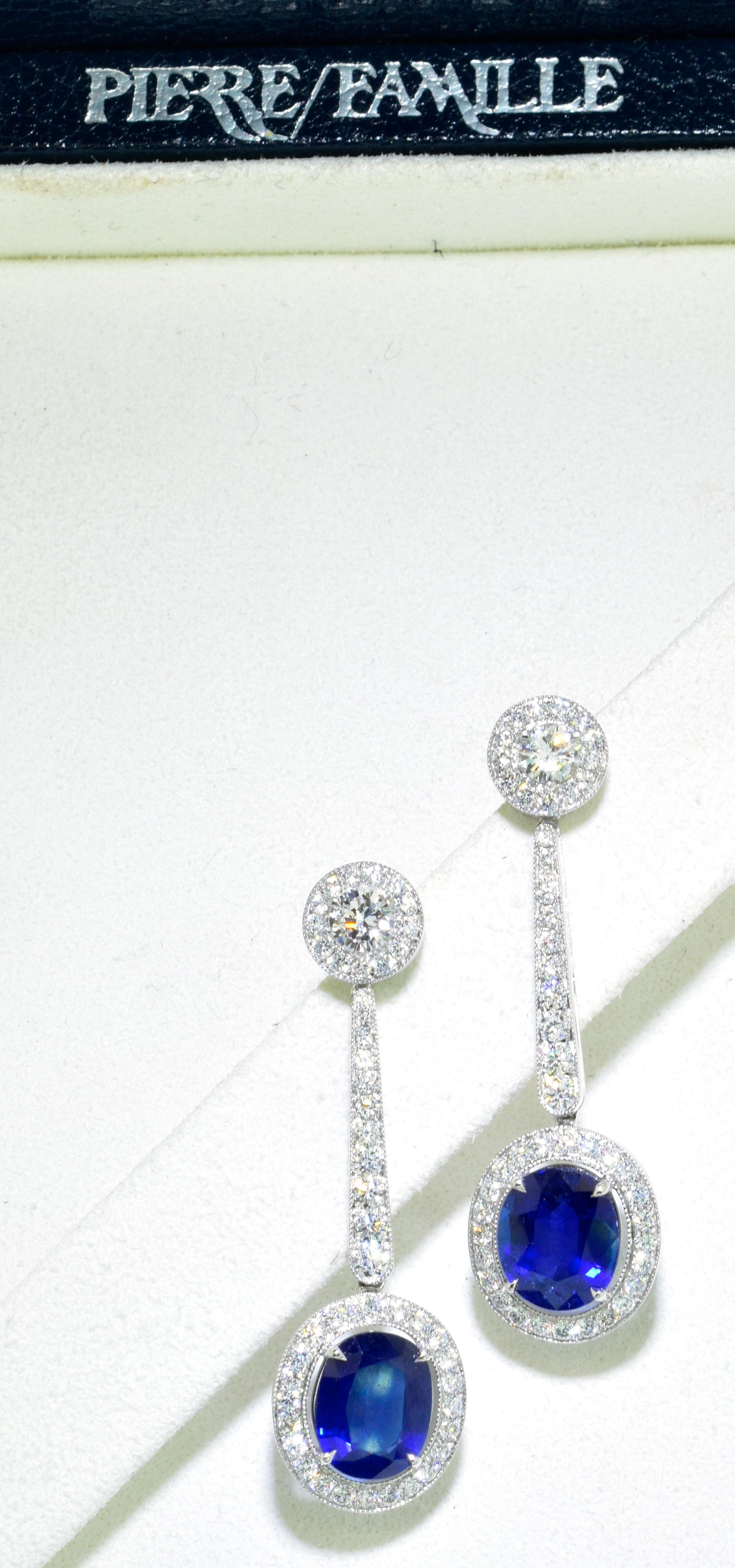 Platinum, diamond and natural sapphire earrings. The sapphires weigh 3.89 cts.  They are natural and unheated and untreated.  The blue is a bright vivid pure royal blue.  These oval cut stones are well matched and well cut.  They are accented with