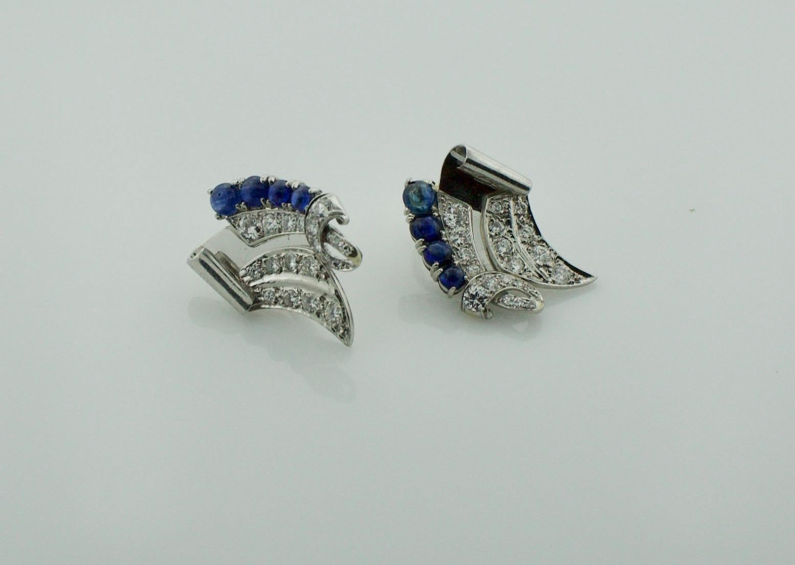 Platinum Diamond and Sapphire Handmade Earrings Circa 1950's 2.00 carats
Comfort and Style 
Eight Cabochon Cut Sapphires weighing 1.60 carats approximately [bright with no imperfections visible to the naked eye]
Forty Round Brilliant and Single Cut