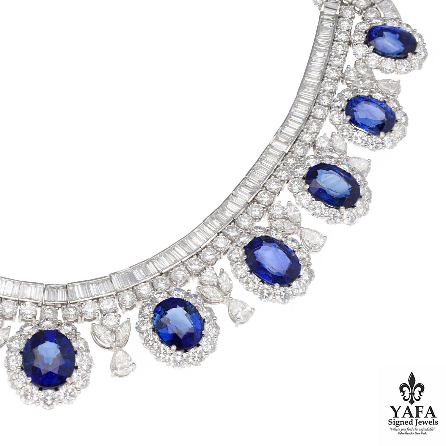 Composed of lines of baguette and round diamonds, the center suspends 11 oval-shaped sapphires in round diamond surrounds, alternating with motifs set with pear-marquise-shaped and round diamonds.

Approximate Diamond Weight - 54.47 CTS
Approximate