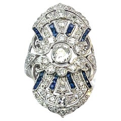 Anello Oyster in platino con diamanti e zaffiri - 6,8g