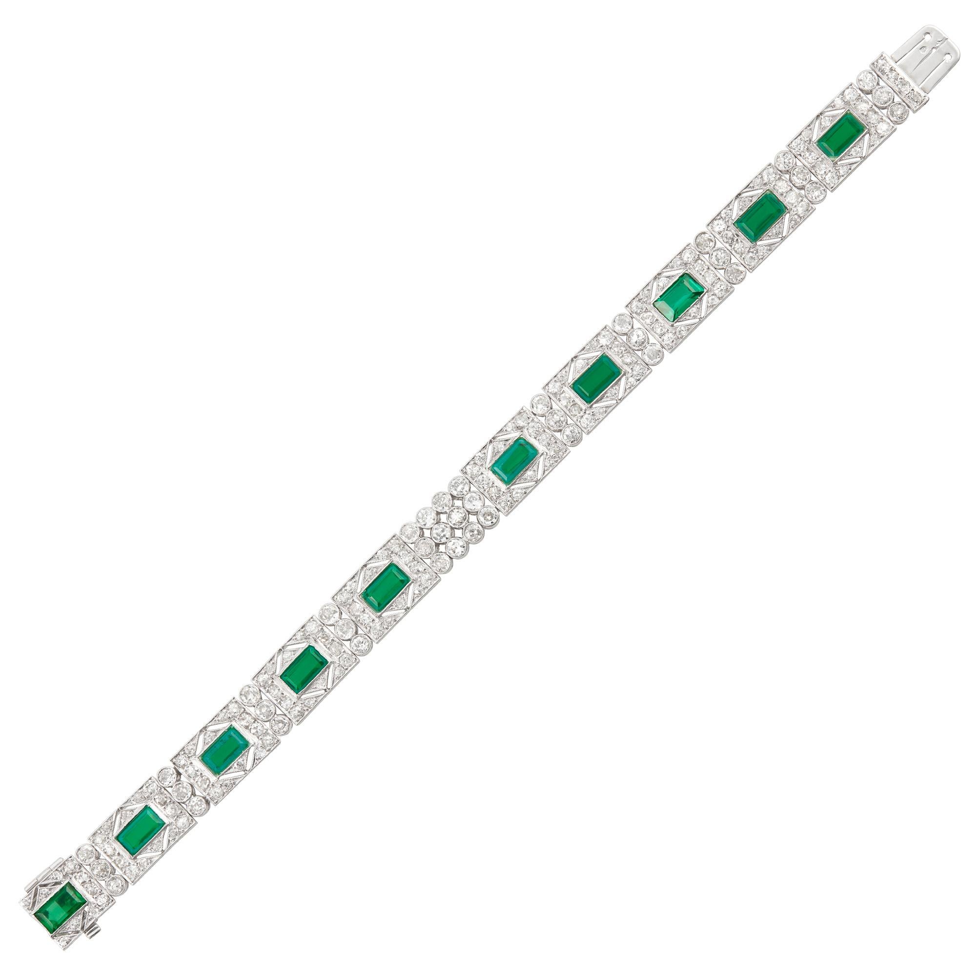 179 old European & single-cut diamonds ap. 7.40 cts., 10 rectangular-shaped simulated emeralds, with French assay marks, c. 1930, ap. 19.4 dwts. Length 7 1/4 inches. 

SKU#B-01844
