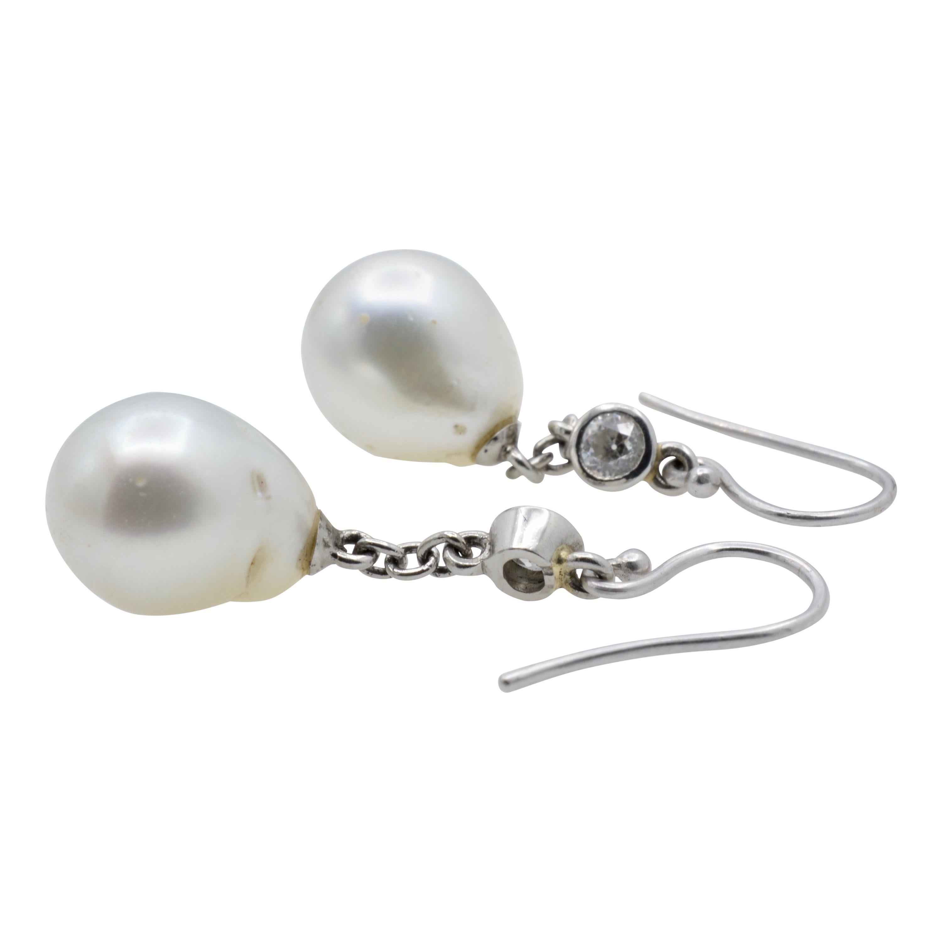 These white South Sea pearls are beautifully dripping from a diamond and platinum chain. The style is classic and chic. You will wear these earrings often!