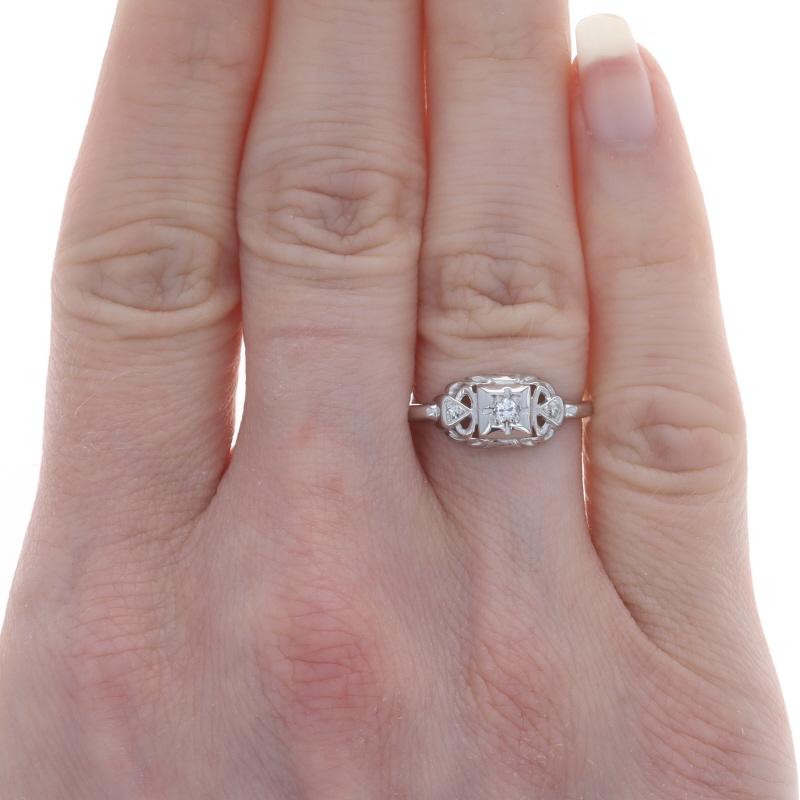 Size: 6
Sizing Fee: Up 1 1/2 sizes for $40 or Down 1 1/2 sizes for $30

Era: Art Deco
Date: 1920s - 1930s

Metal Content: Platinum

Stone Information
Natural Diamond
Carat(s): .06ct
Cut: Round Brilliant
Color: I
Clarity: VS1

Natural