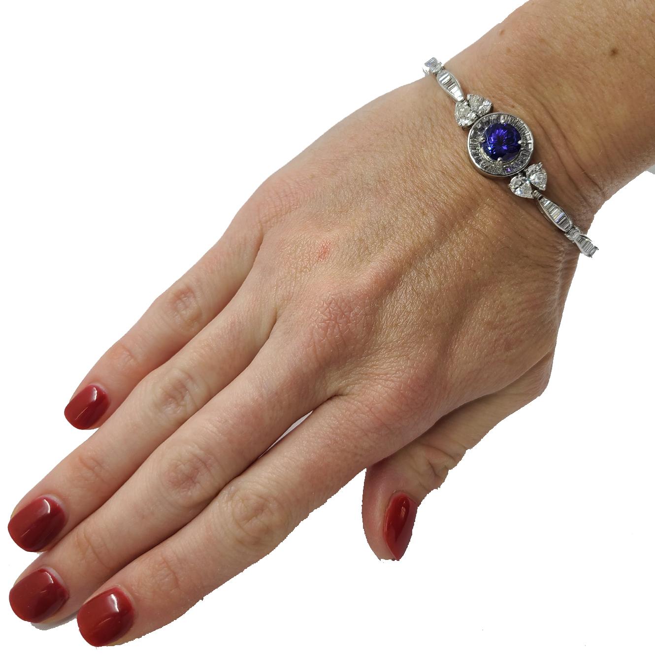 Custom One-of-a-kind Platinum Bracelet Featuring a 3.16 Carat Round Tanzanite & 104 Round & Baguette Cut Diamonds of VS Clarity & G Color Totaling Approximately 5 Carats. 6.75 Inches Long With Hidden Clasp & Safety. Finished Weight is 21.7 Grams.