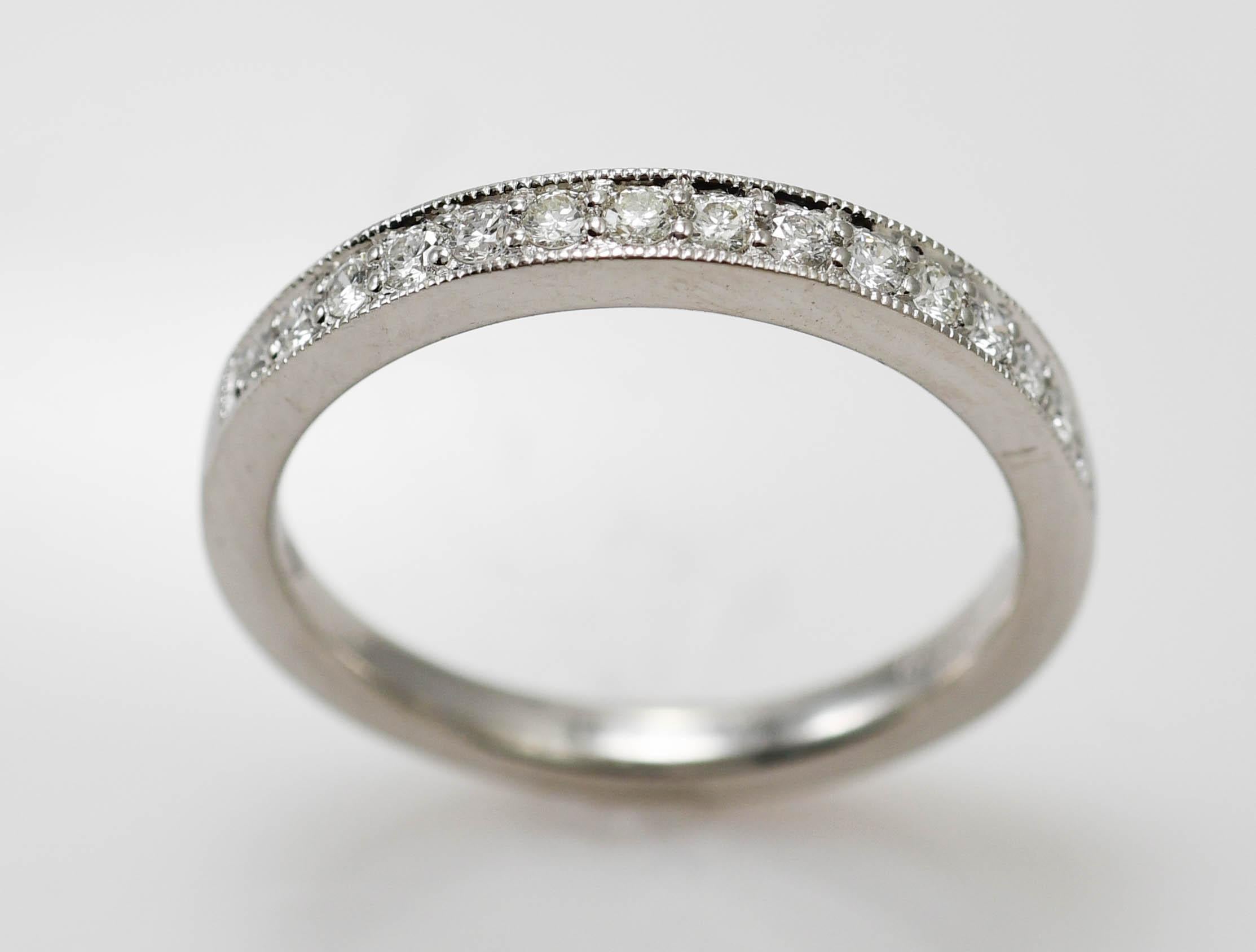 Platinum diamond band.
Stamped PT950 and weighs 4.6 grams.
The diamonds are round brilliant cuts, .30 total carats, G to H color, VS clarity.
The ring measures 2.8mm wide.
The ring size is 7 and can be sized.
The condition is like new.
Excellent