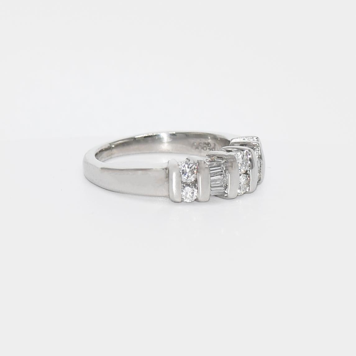 Platinum Diamond Band .50tdw, 7g
Ladies platinum and diamond ring. Stamped Pt 900 and weighs 7 grams.
The diamonds are round brilliant and baguette cuts, .50 totat carats, H,i, J color range, Vs to Si clarity.
The top of the ring measures 5.5mm