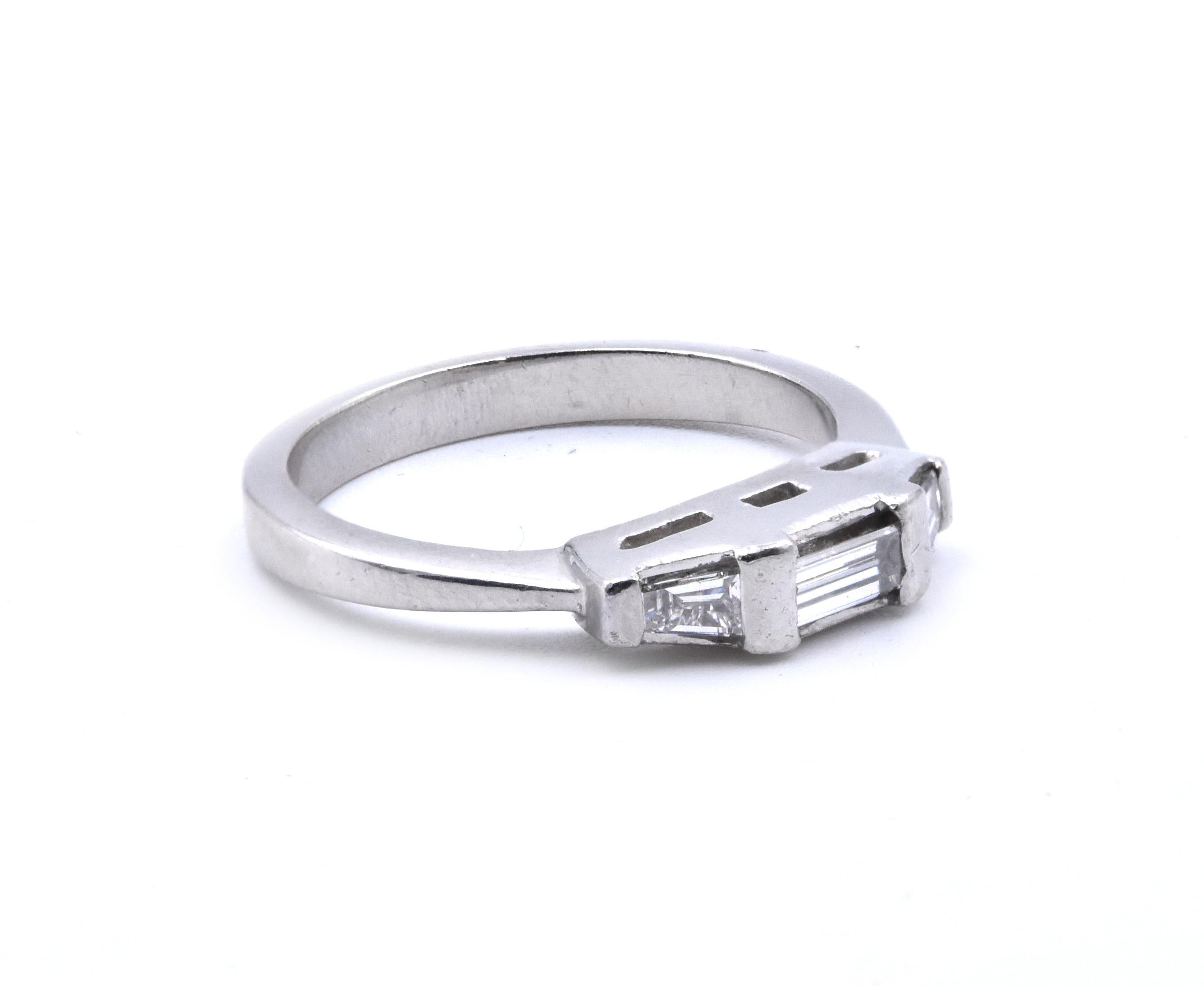Designer: custom
Material: platinum
Diamonds: 3 baguette cut = .30cttw
Color: I
Clarity: SI2
Size: 5 (please allow two additional shipping days for sizing requests)  
Dimensions: ring measures 3.5mm in width
Weight: 4.9 grams