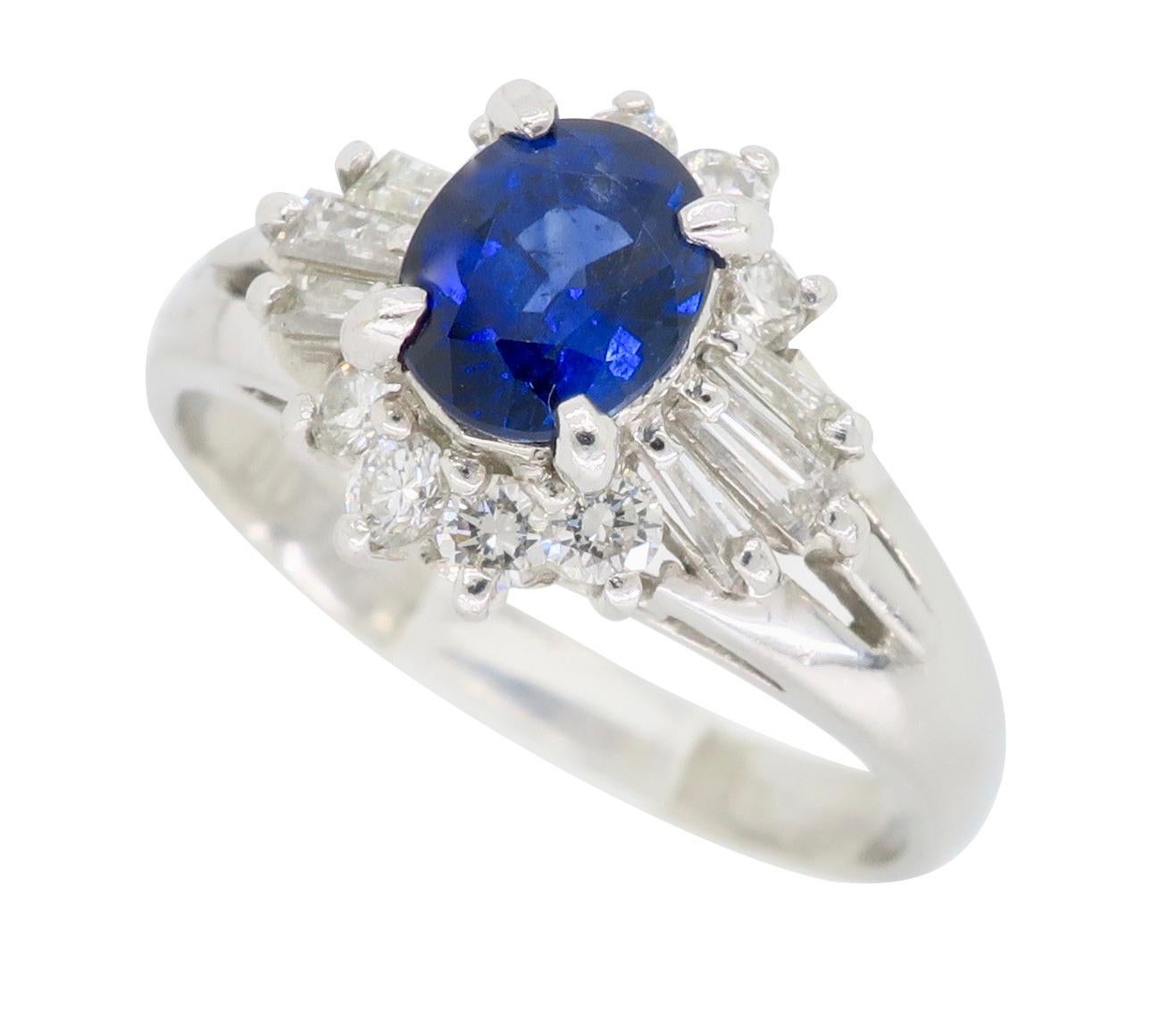 Oval Cut Platinum Diamond and Blue Sapphire Halo Ring