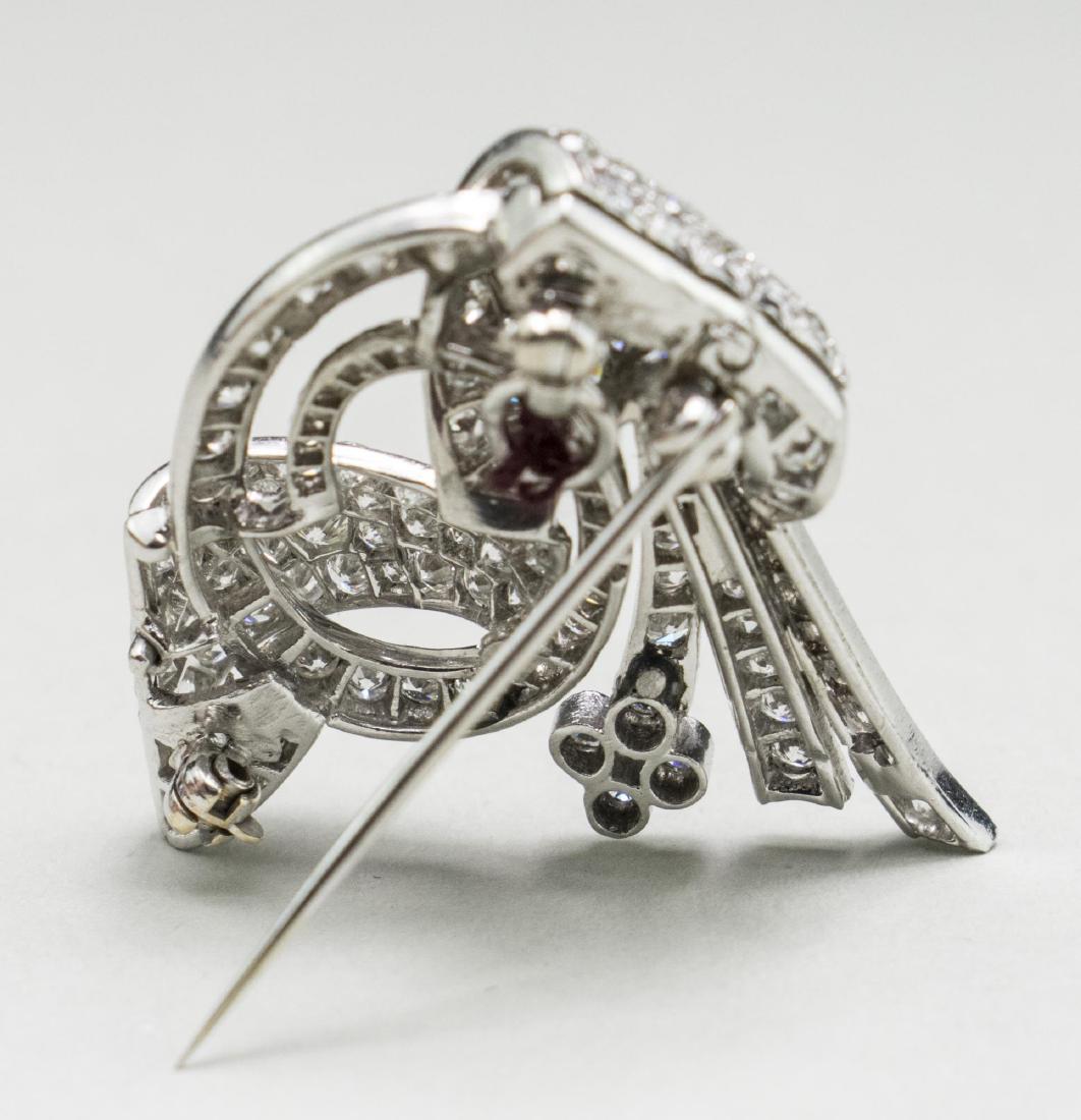 Platinum bow brooch set with approximately two hundres diamonds tcw 2.50 carats. 1 1/8 x 1 1/8 inches, 8.3 grams