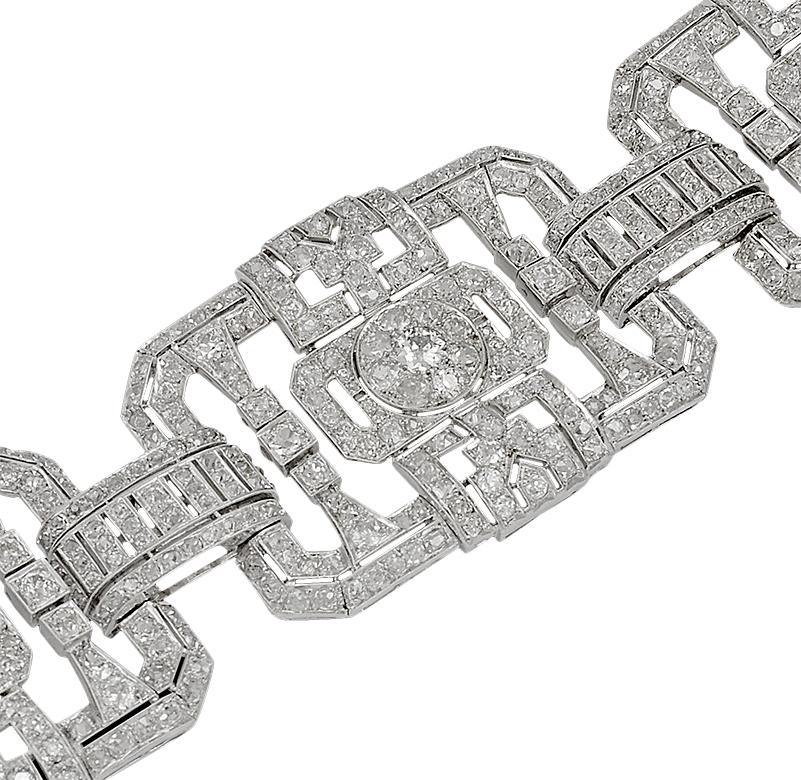 A timeless 1960's bracelet composed of three openwork plaques of rectangular form,  pavé set with 40 carats of luminous diamonds, finely mounted in platinum, measuring approximately 8.5