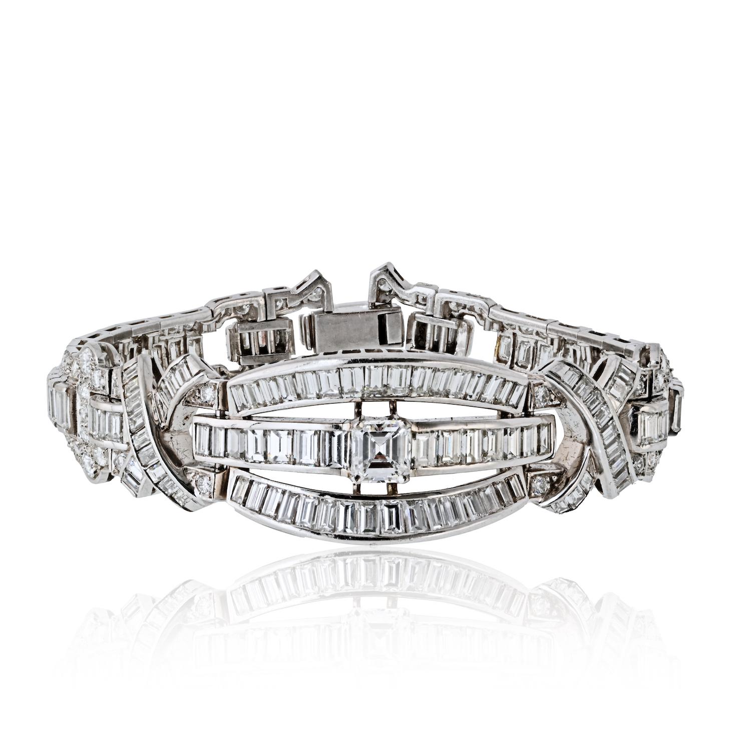 This exceptional estate bracelet, dating back to the 1960s, is a striking example of mid-century glamour and meticulous craftsmanship. Handcrafted in luxurious platinum, the bracelet features a sophisticated geometric design that exudes timeless