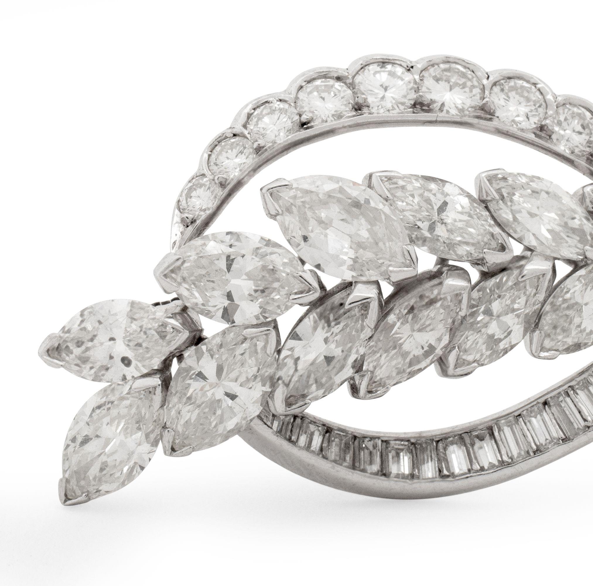 Platinum Diamond Brooch Pendant, adorned with 16 marquise brilliant cut diamonds, 26 baguette diamonds and 15 round brilliant cut diamonds weighing a combined total of approx. 7.55 carats, G-I color / VS-SI clarity, worn as a brooch with pinstem,