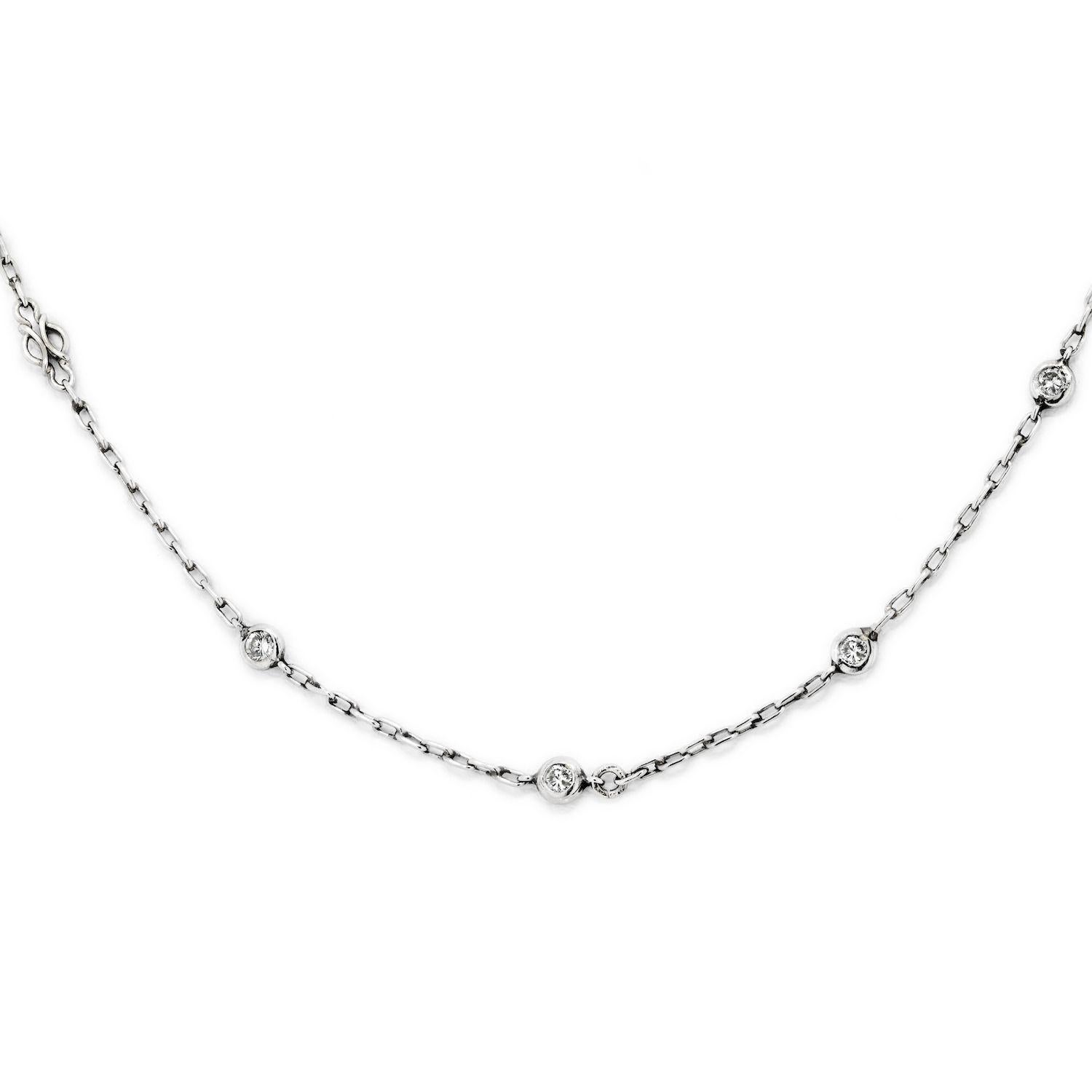 The vintage platinum chain necklace that features 10 round diamonds of total carat weight 0.50cttw is a delicate piece of jewelry. The chain is crafted from high-quality platinum, which is known for its durability and luster, and is designed to sit