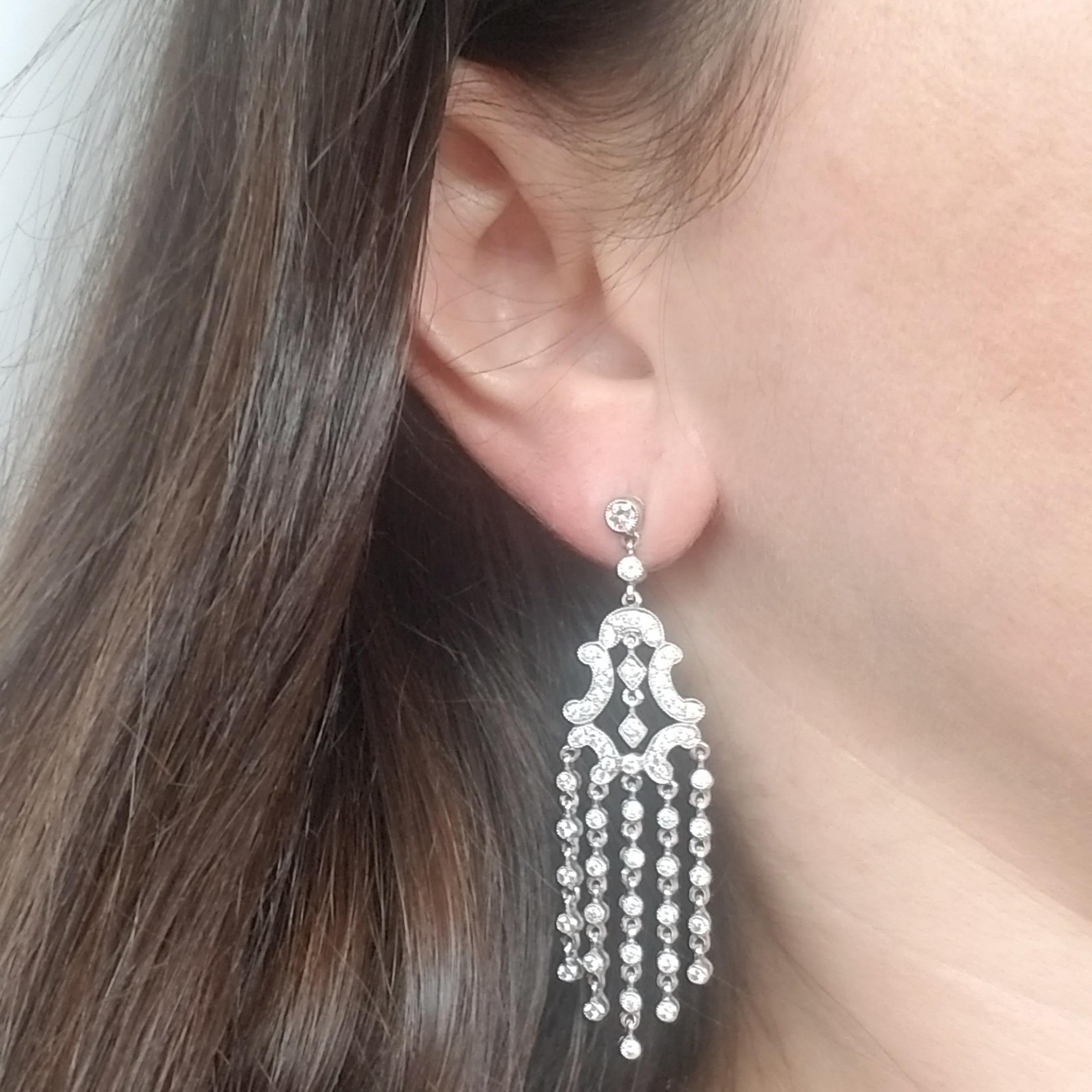 Platinum and Diamond Dangle Earrings Featuring 190 Prong & Bezel Set Round Brilliant Cut Diamonds Totaling 2.35 Carats. Diamonds are SI Clarity & G Color. Friction Post with Large Friction Backs.