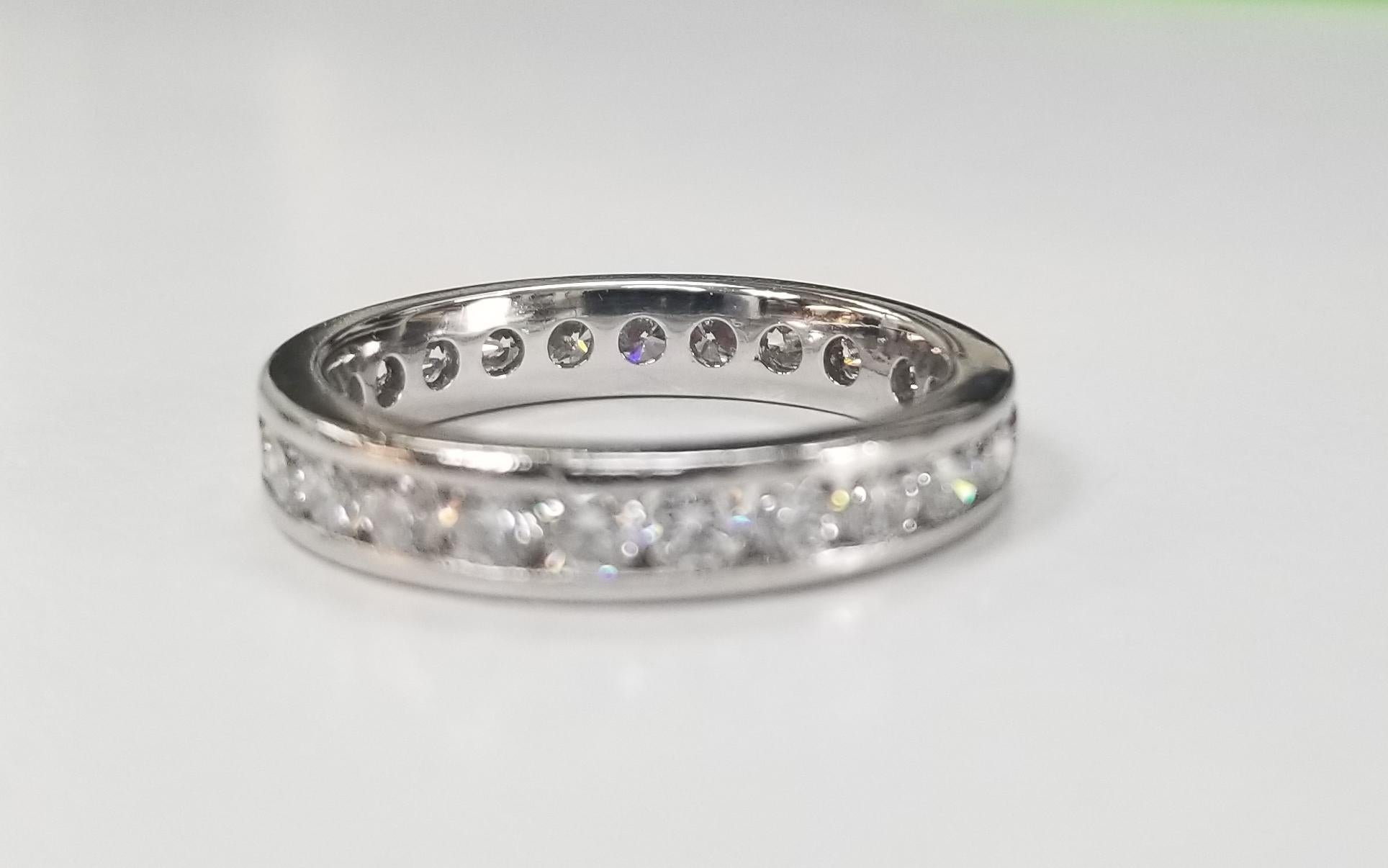Platinum Diamond channel set eternity ring, containing 25 round full cut diamonds; color 